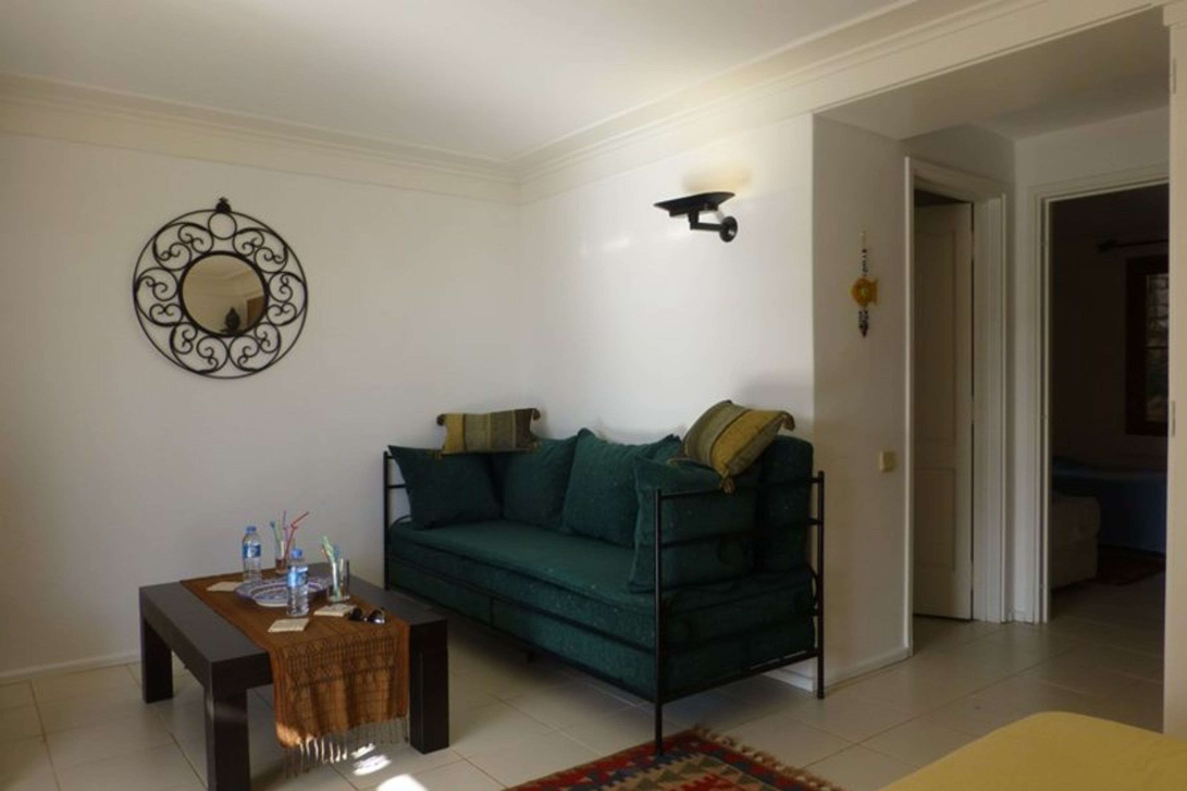 Relax in the informal Turkish style living area, with a television, DVD player, DVDs and plenty of books ....