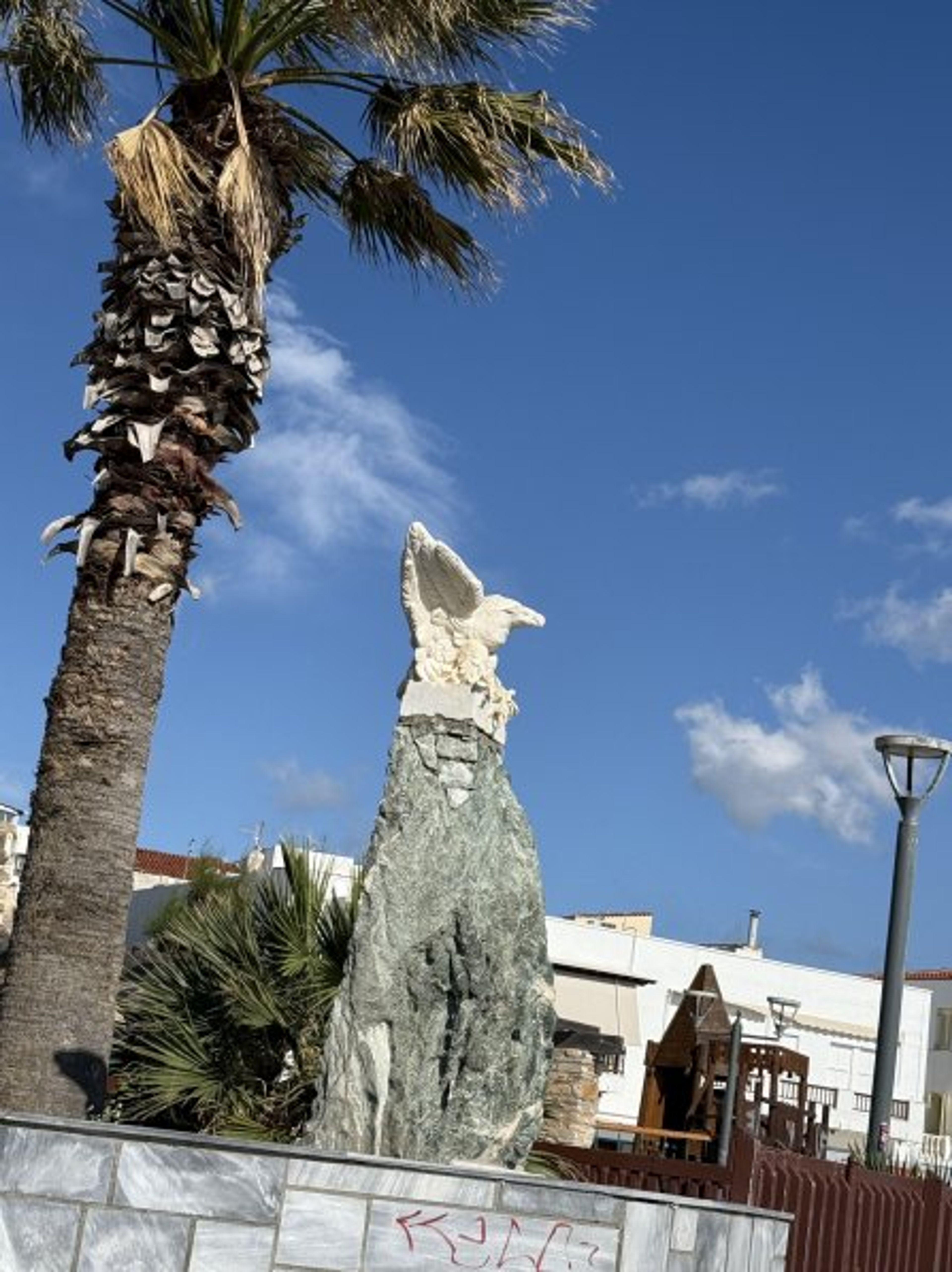 Eagle statute at meeting Location upon arrival near port of Tinos 