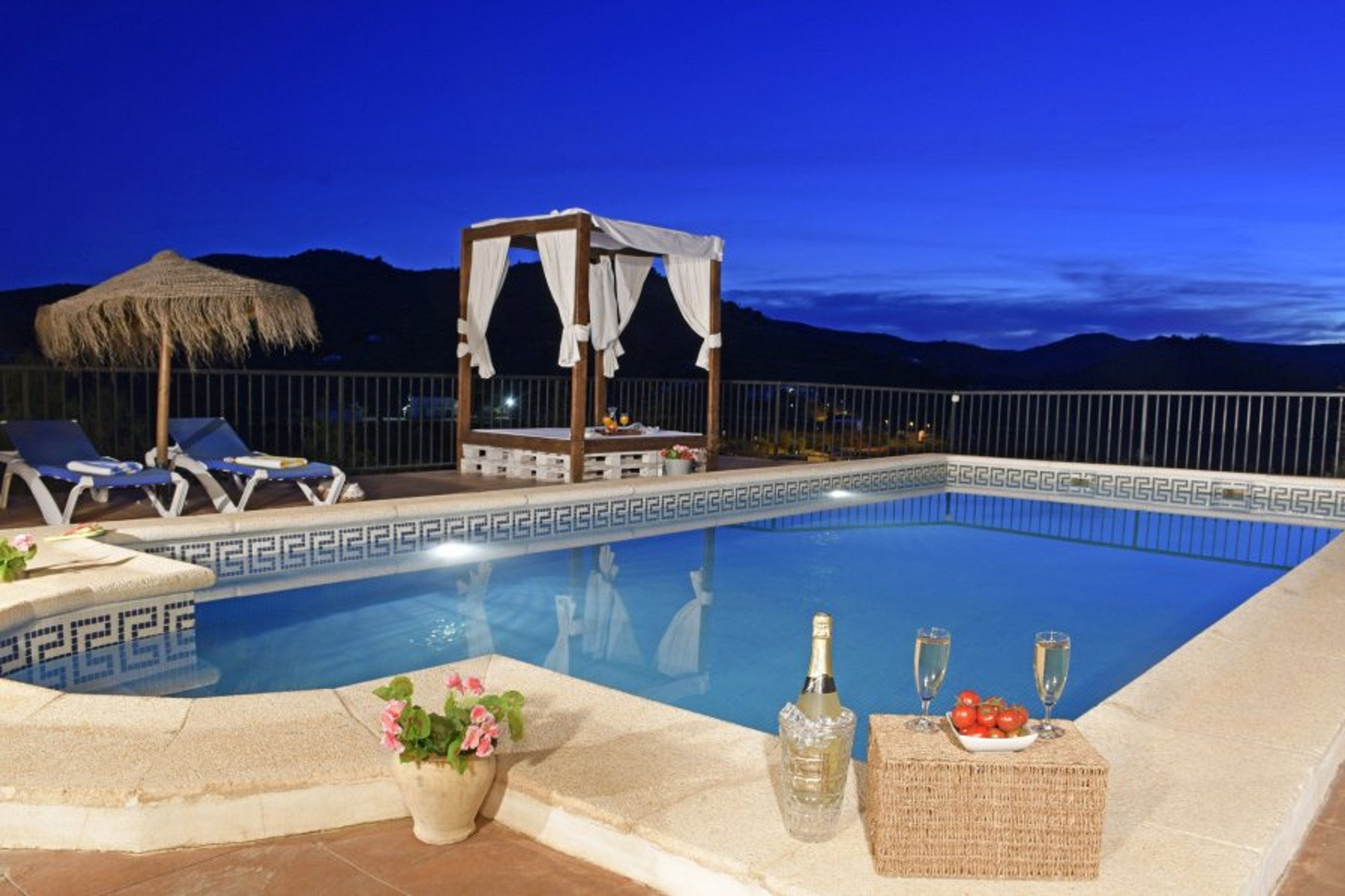 The stunning villa at night, with private pool and amazing views!
