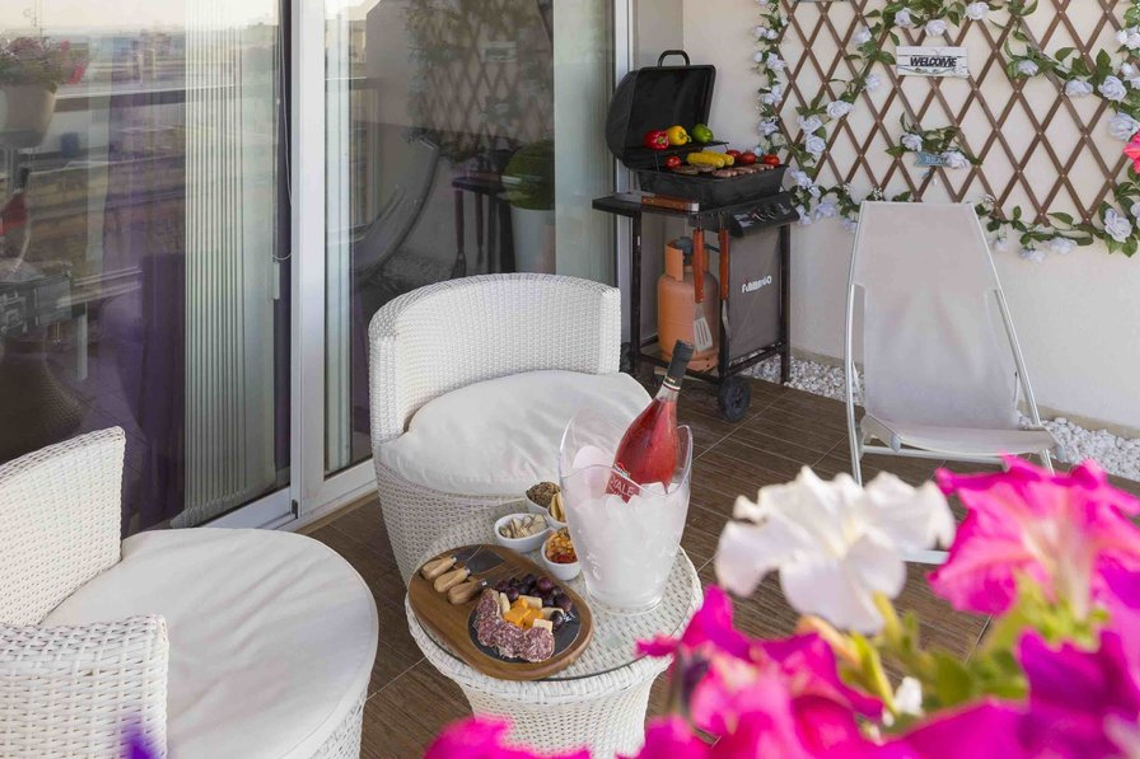 Balcony Area with outdoor furniture and BBQ