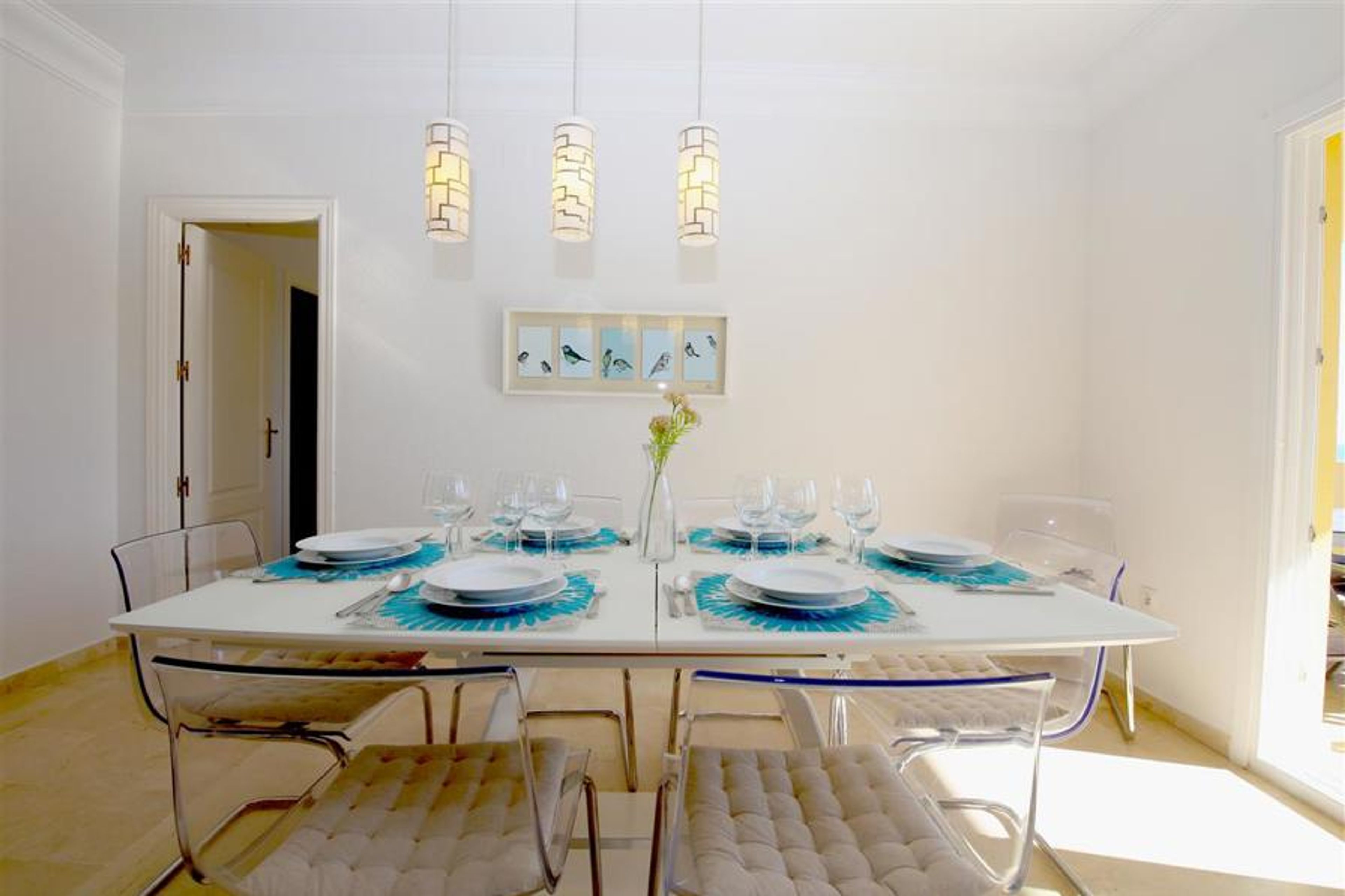 Modern dining area for six guests on a side of the