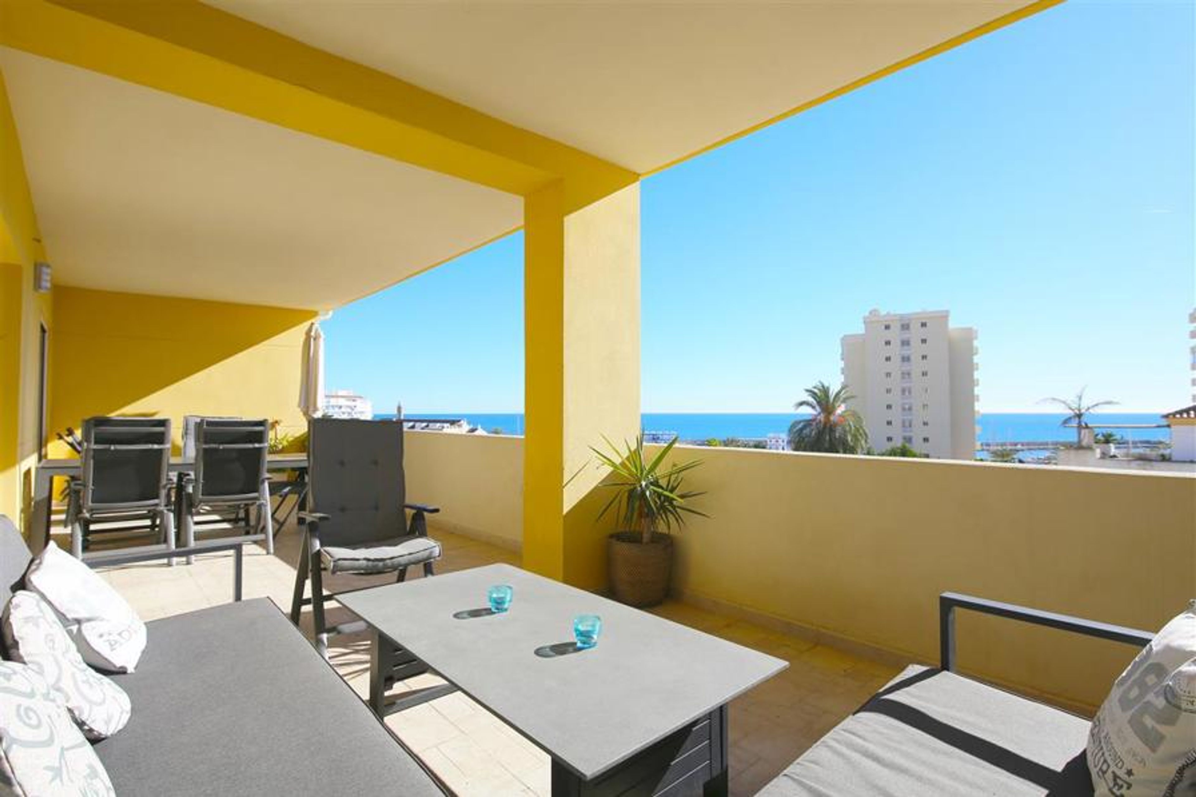 Large terrace facing south with comfortable seatin