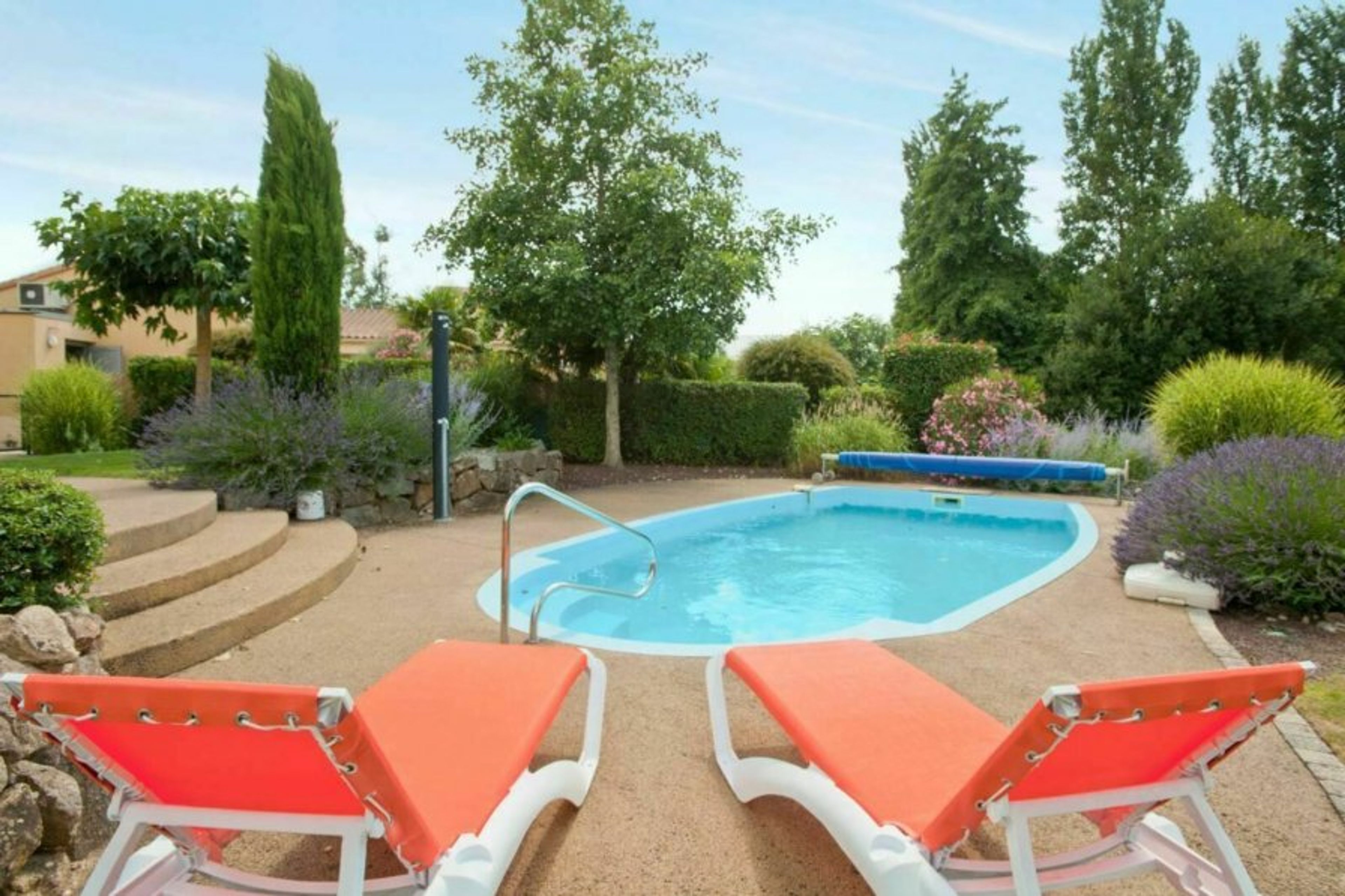 Photo of a pool shown as example. Actual pool and garden may vary.