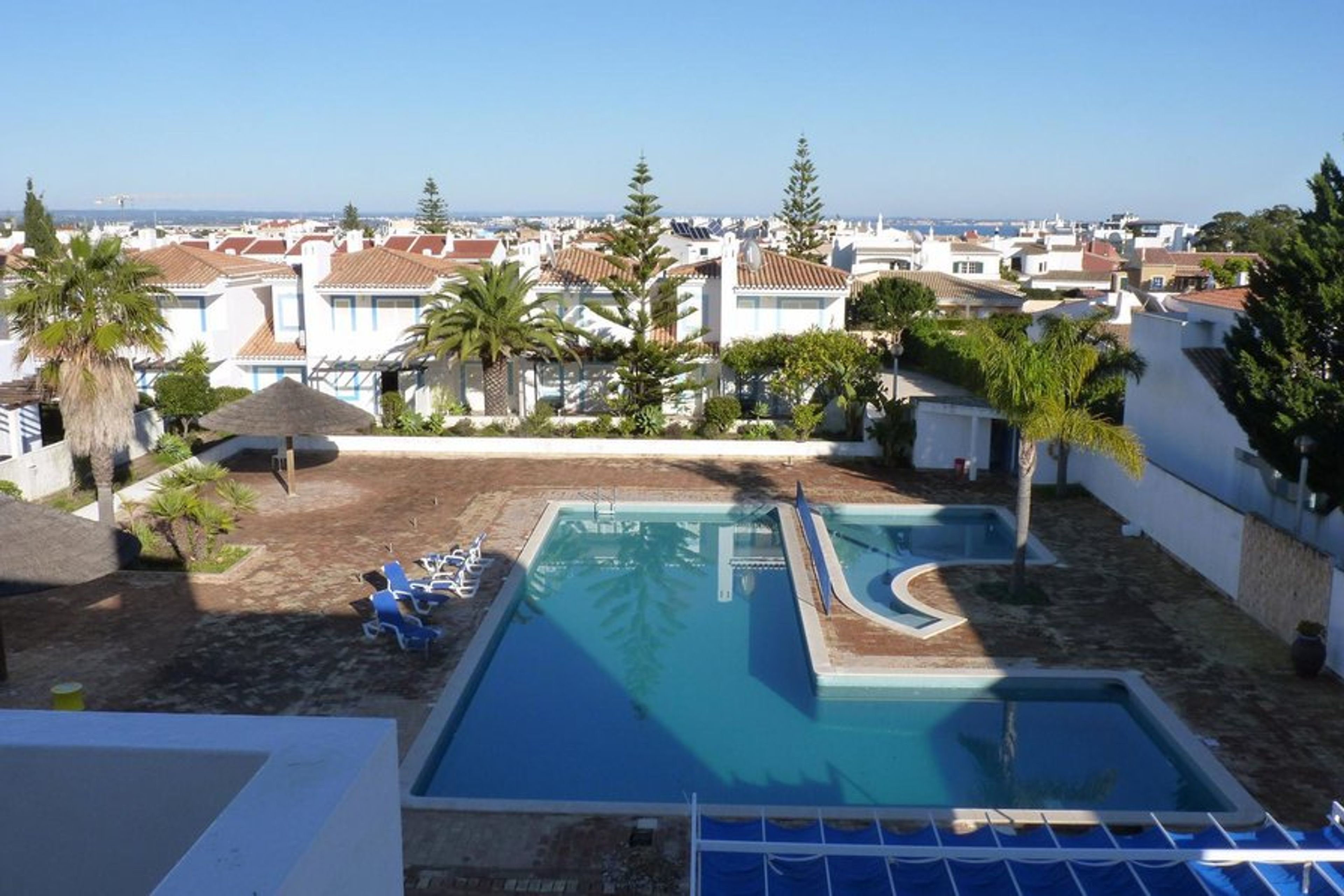 View from balcony across pools to Bay of Lagos