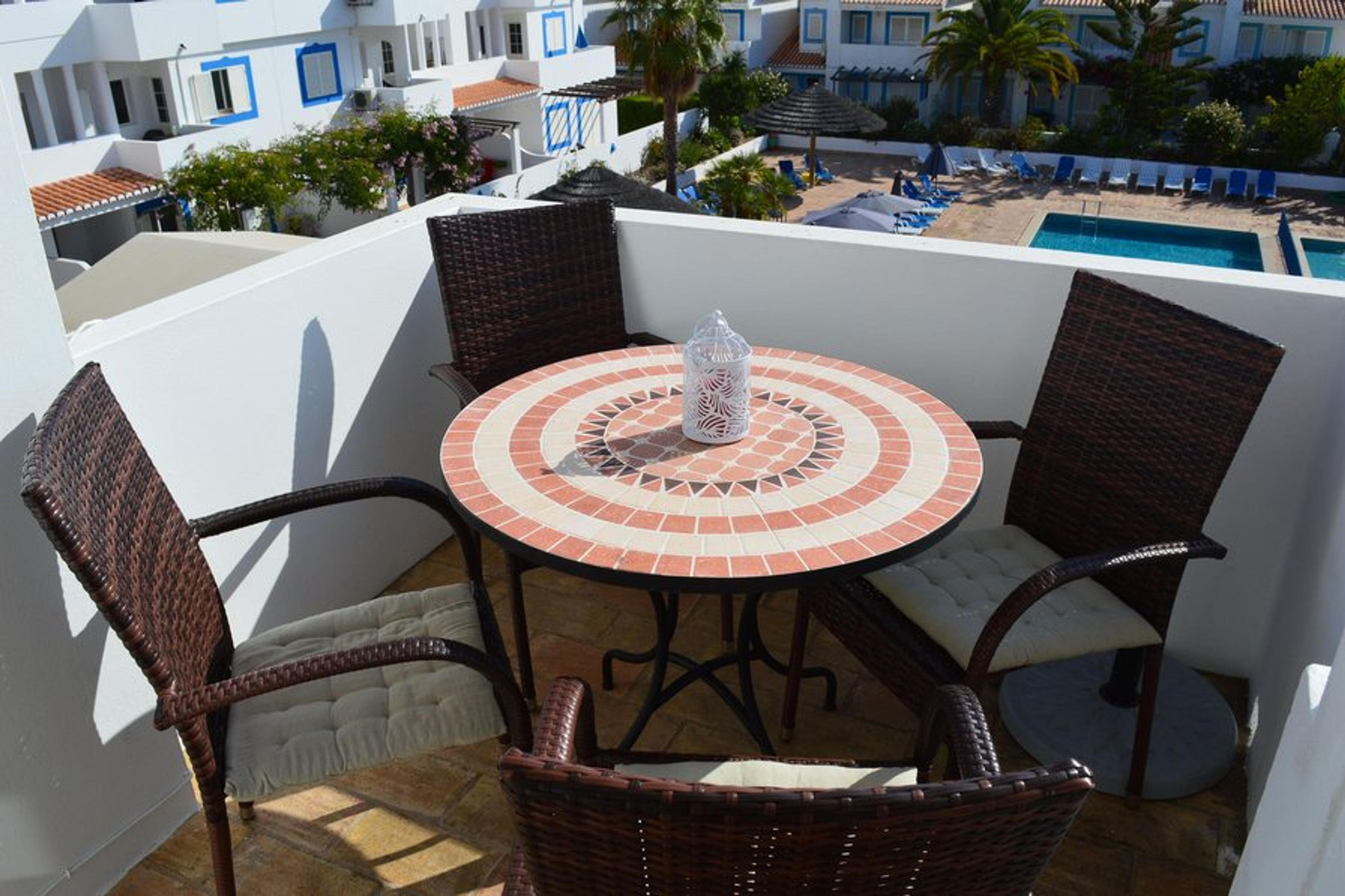 Balcony overlooking swimming pool.