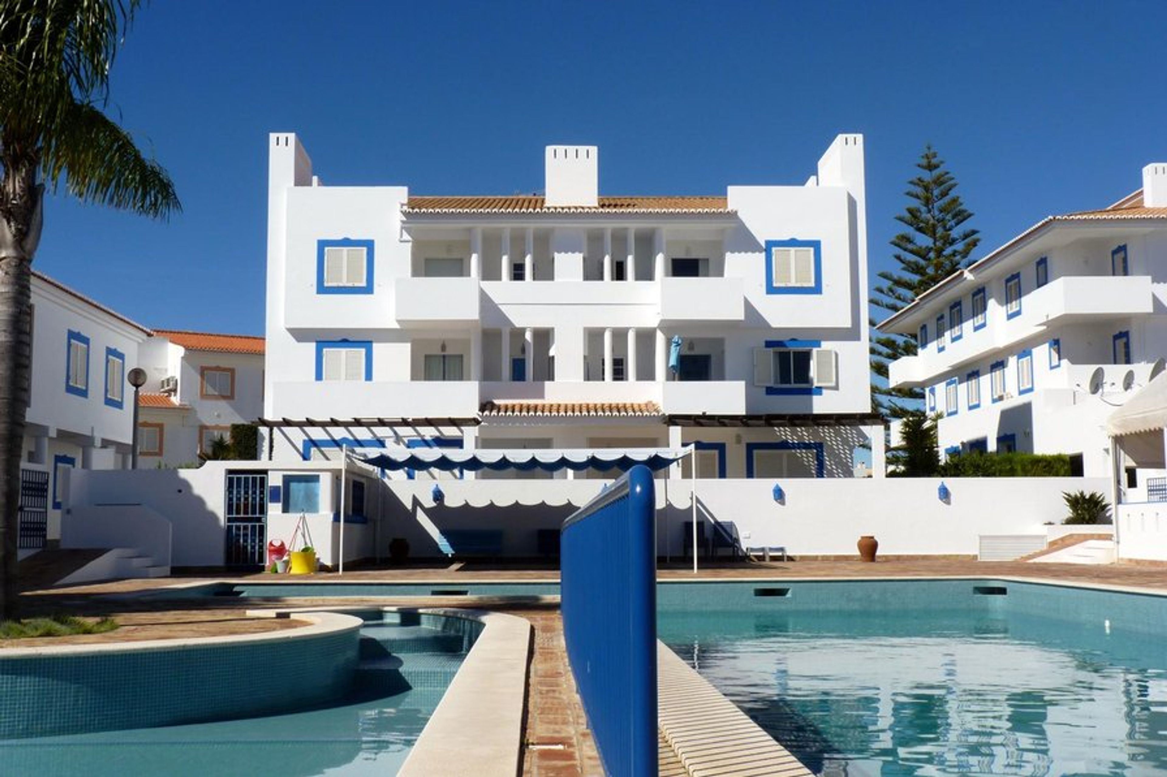 Apartment (top floor, right) overlooks adults' and children's pools