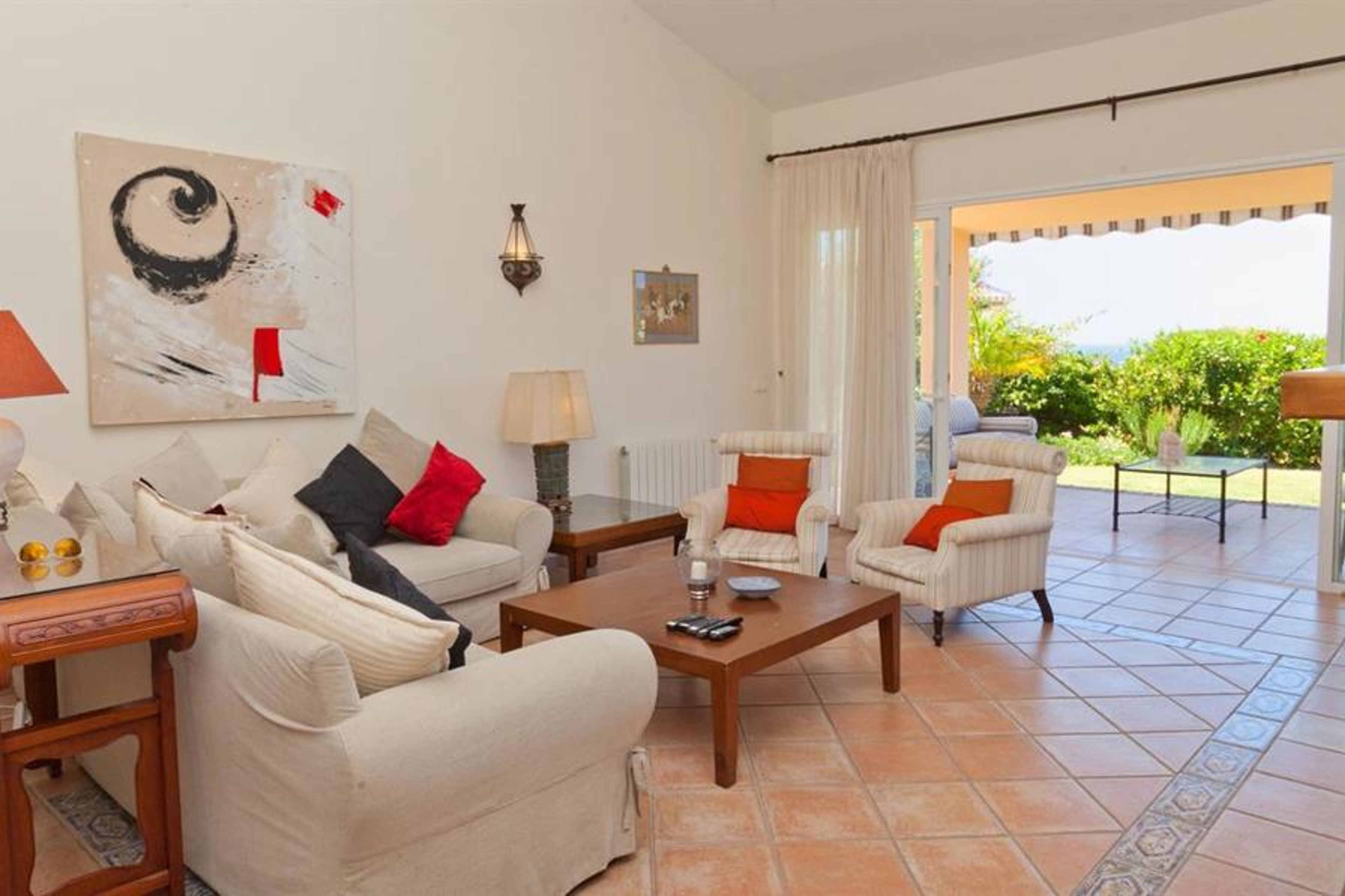 Large living room with high ceilings and plenty of