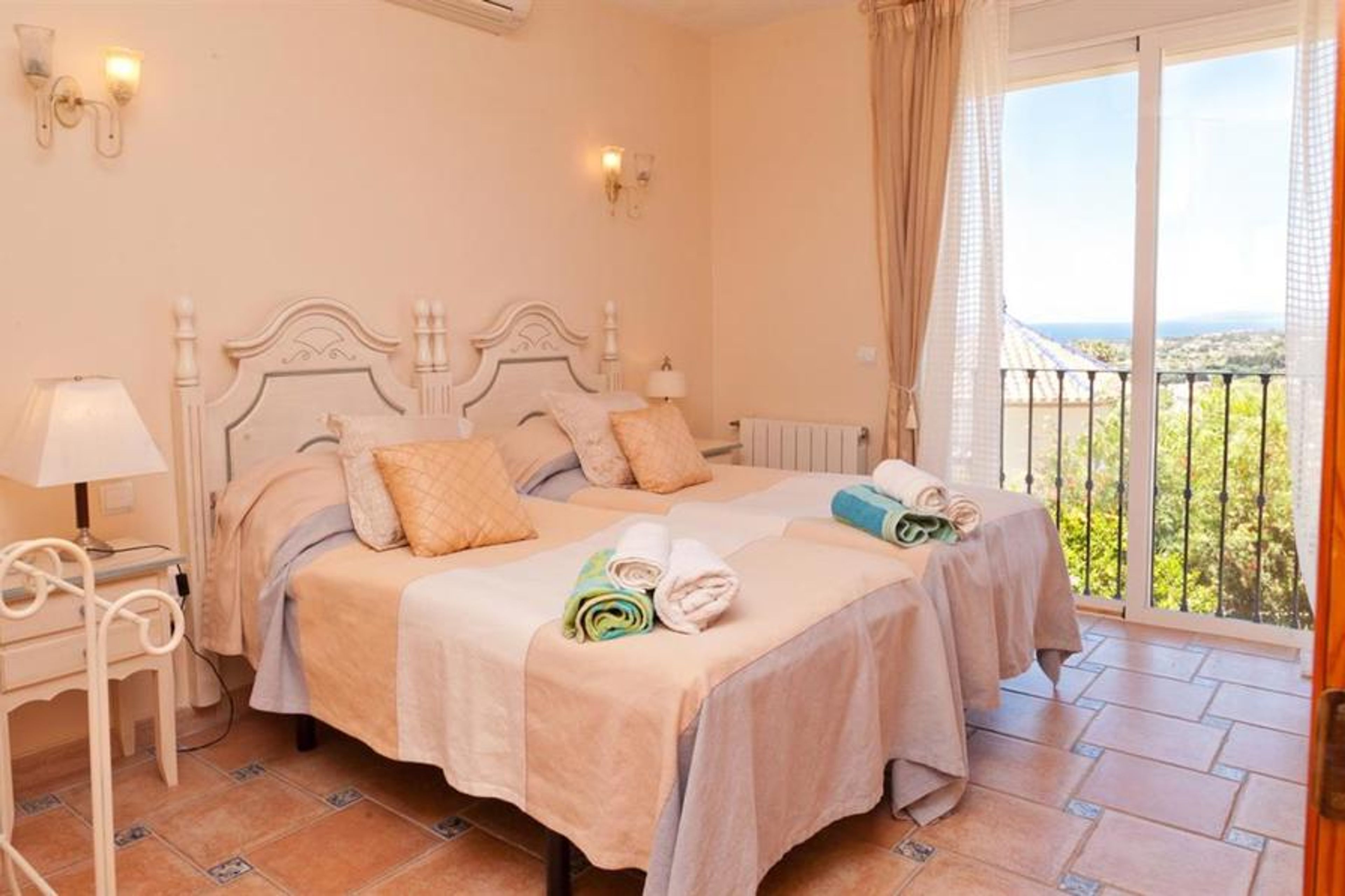 First bedroom with two single beds and sea views