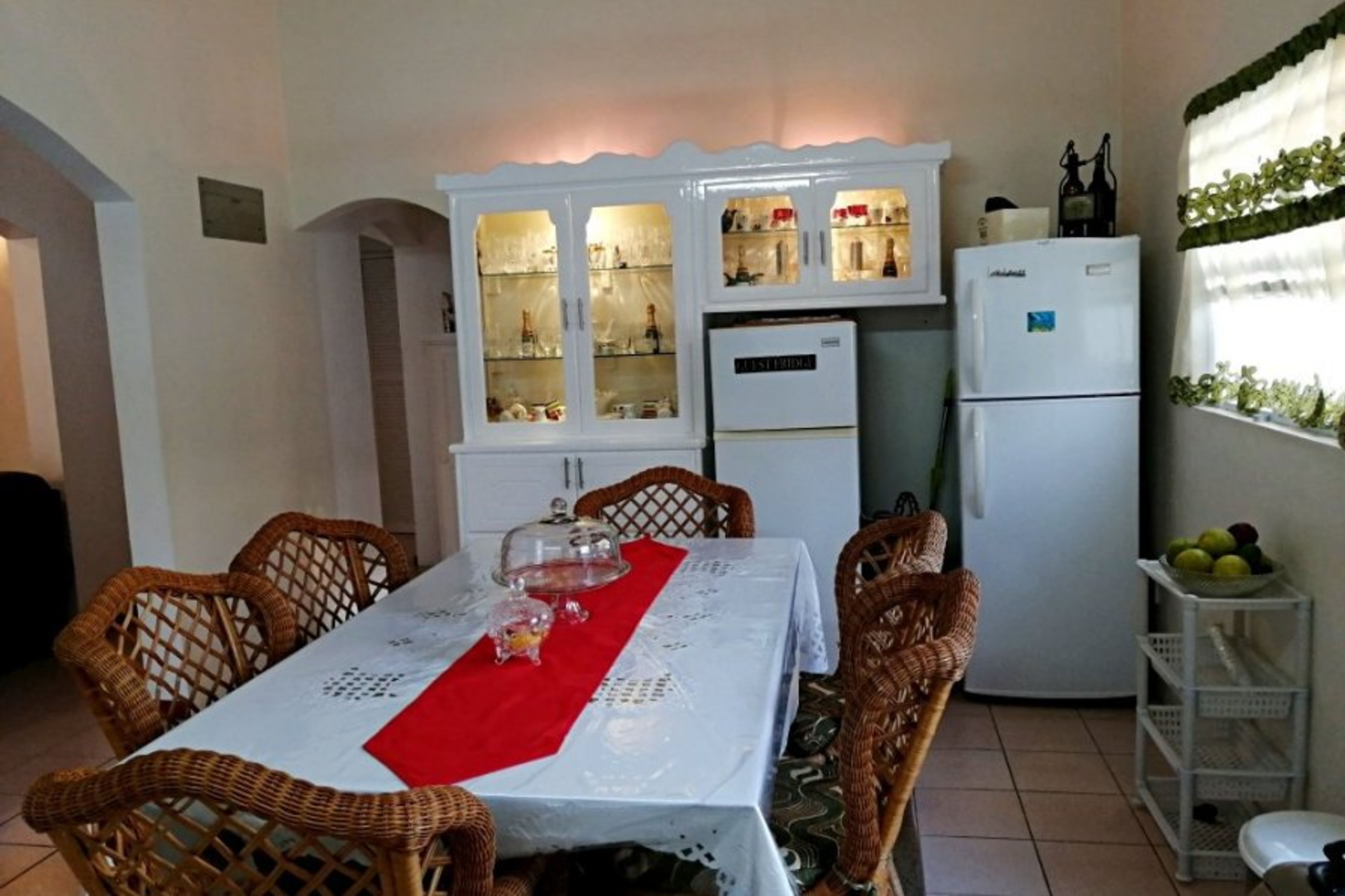 Kitchen with guests fridge and sufficient glassware