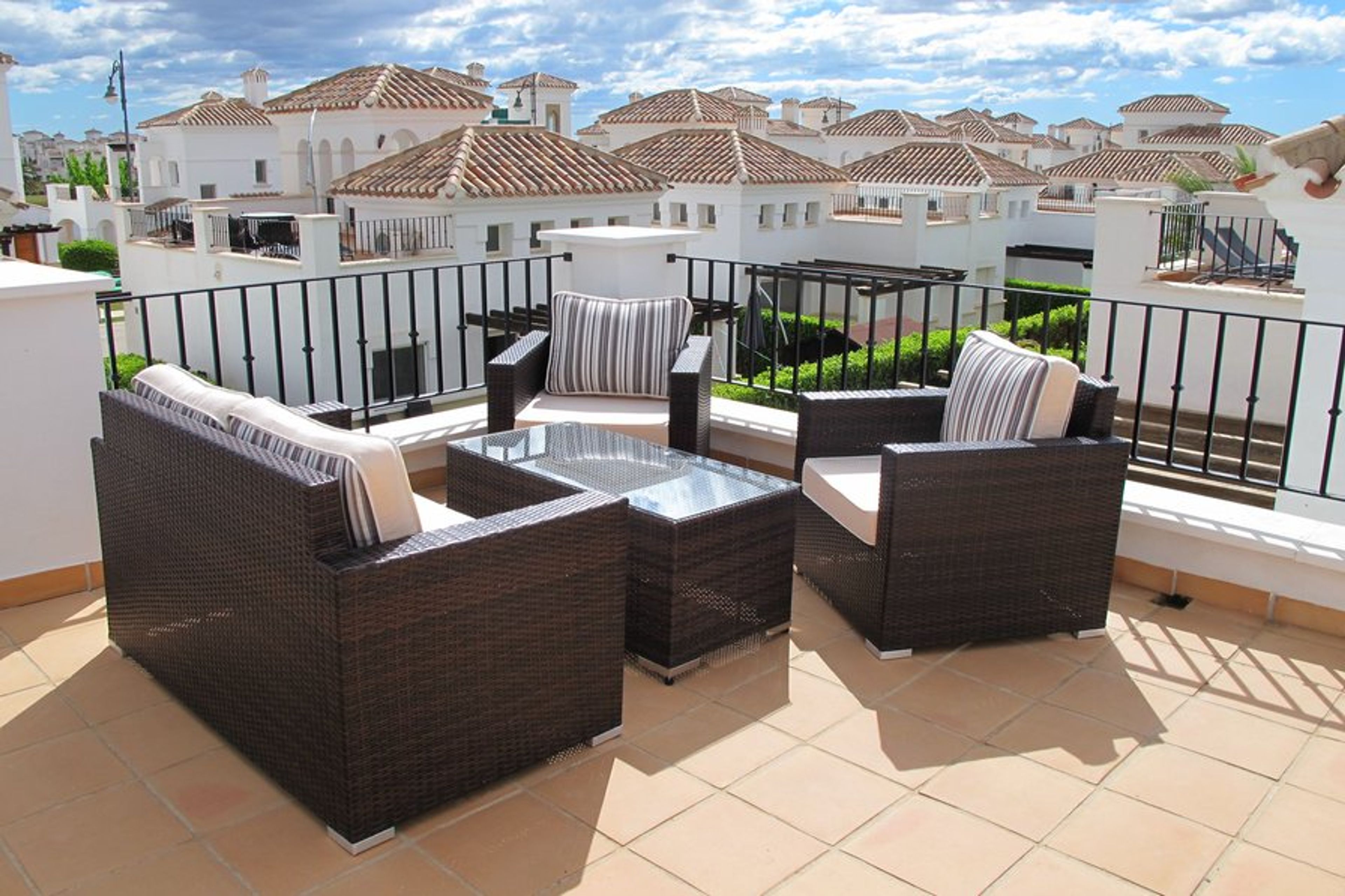 Sunny roof terrace with patio furniture shown - perfect for breakfast!