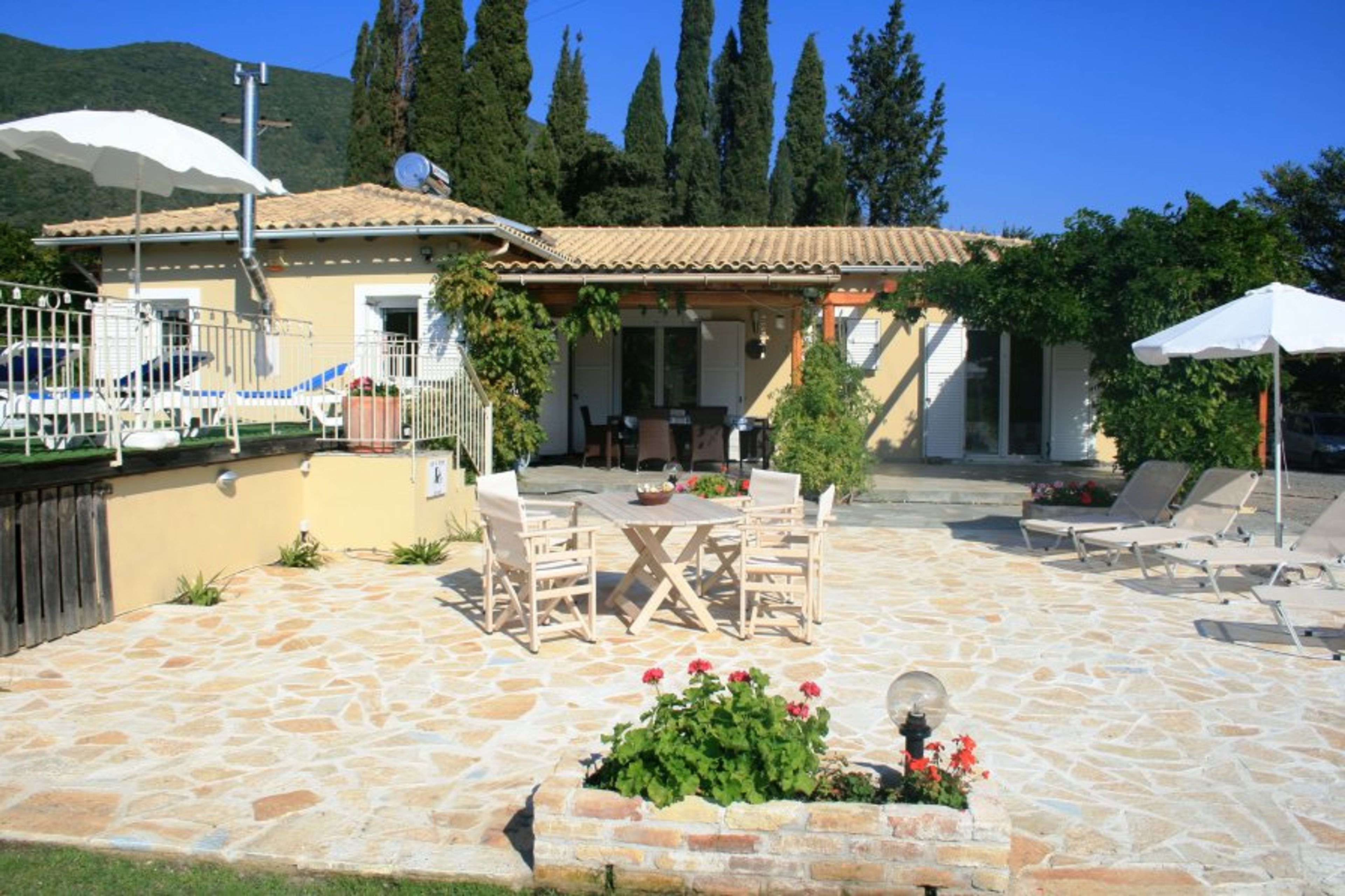 The extended patio area next to the pool.