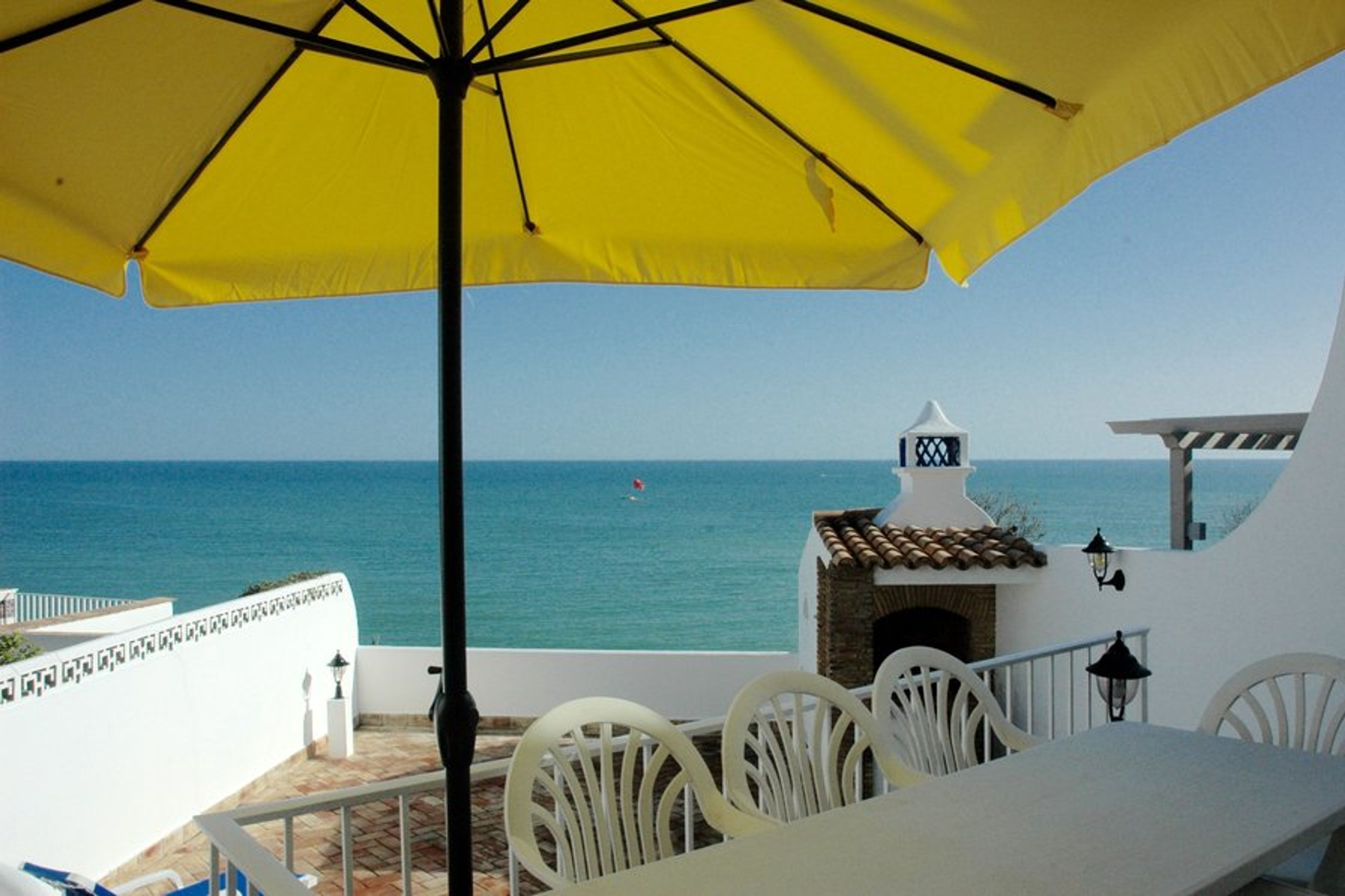Terrace with table, chairs and a built in BBQ with incredible views