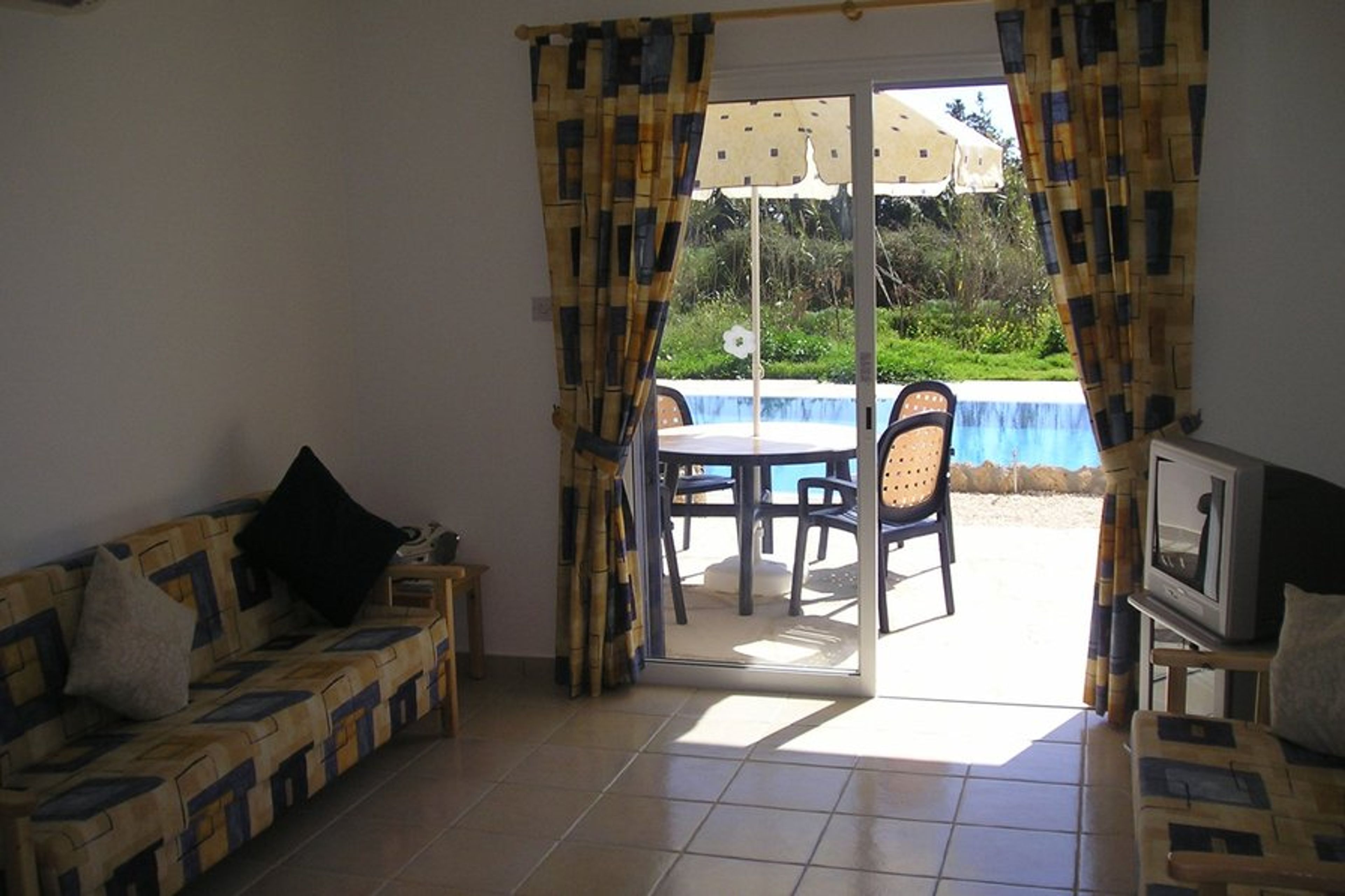 Comfortable open plan lounge leading out to the pool