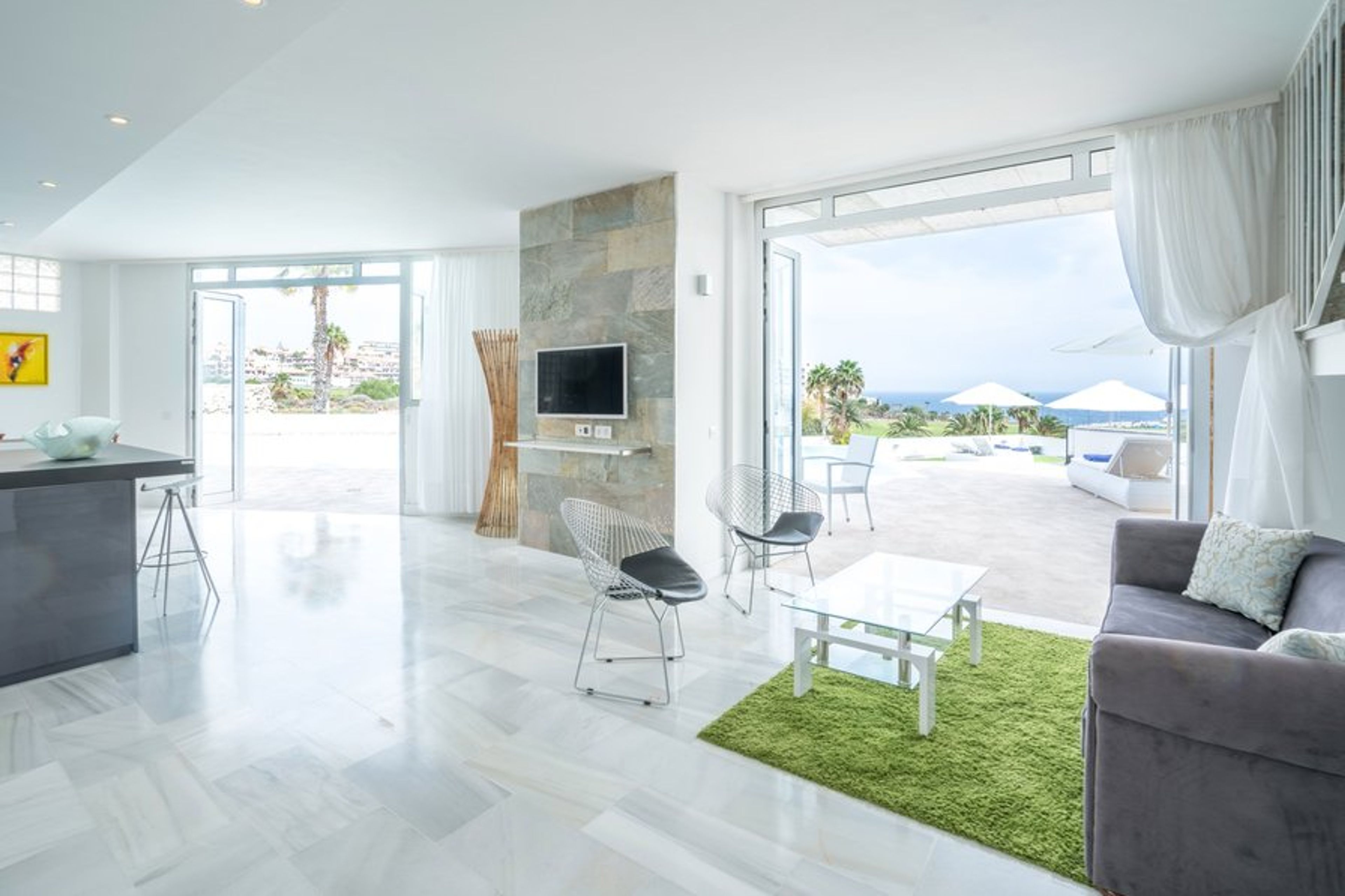 Spacious living room opening up to terrace