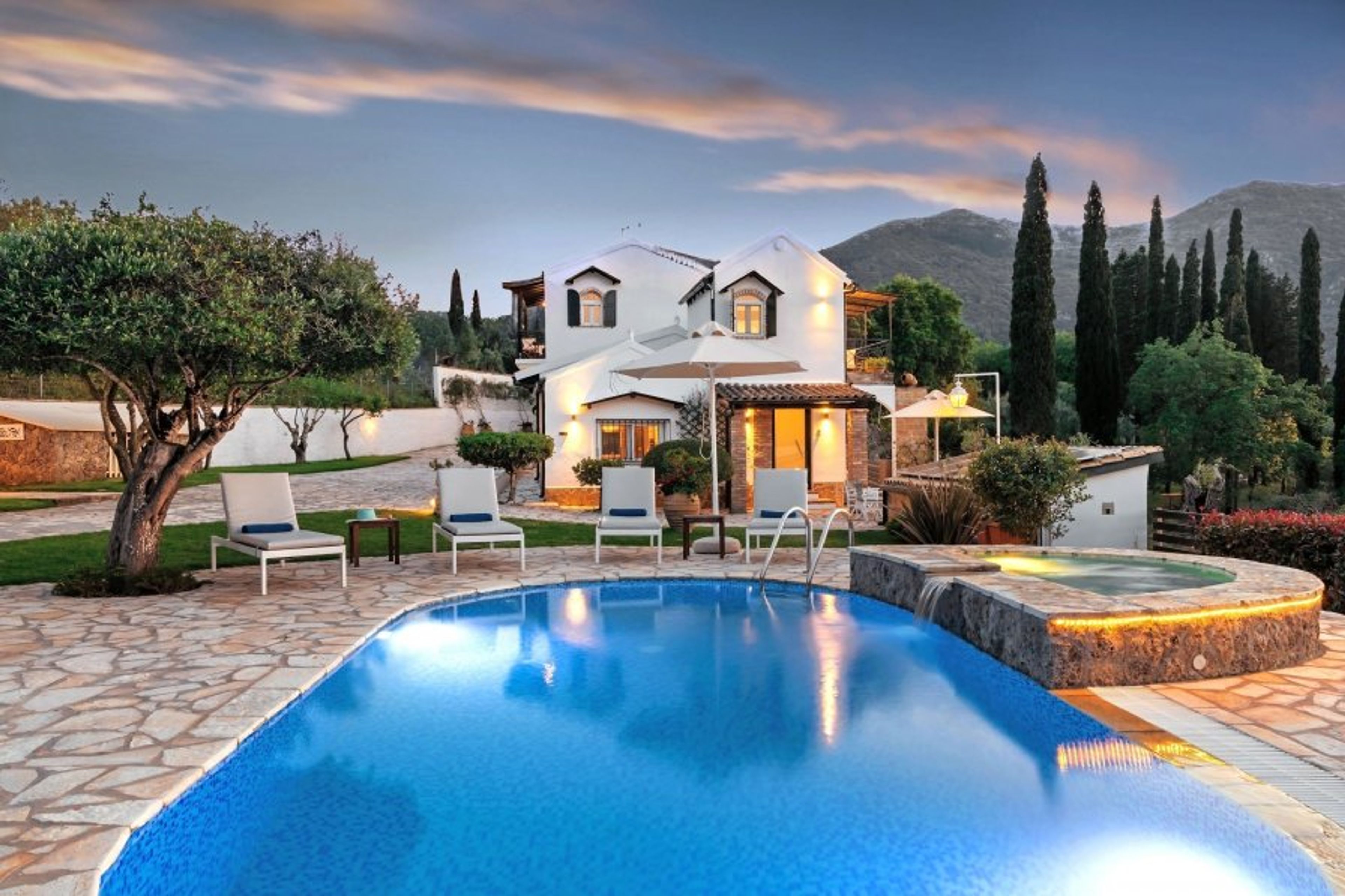 Twilight pool reflections facing the main house