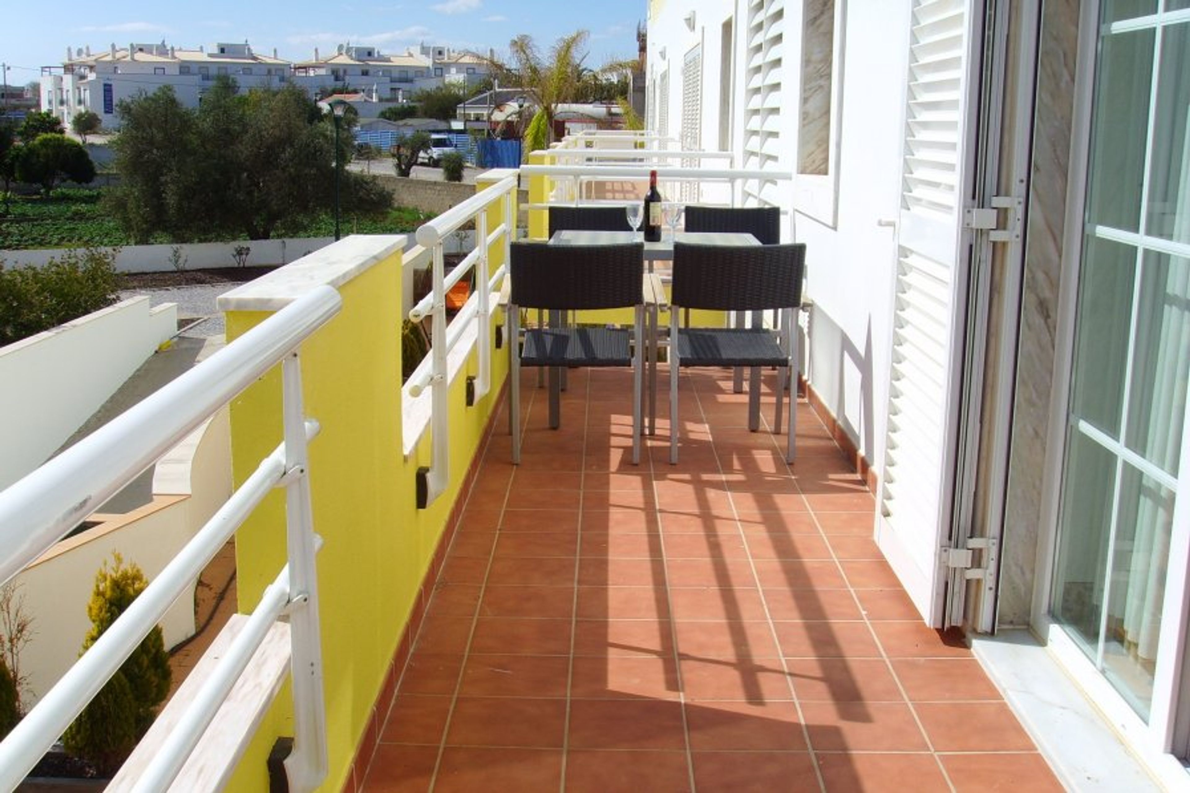 Lower balcony facing away from the sea with BBQ.