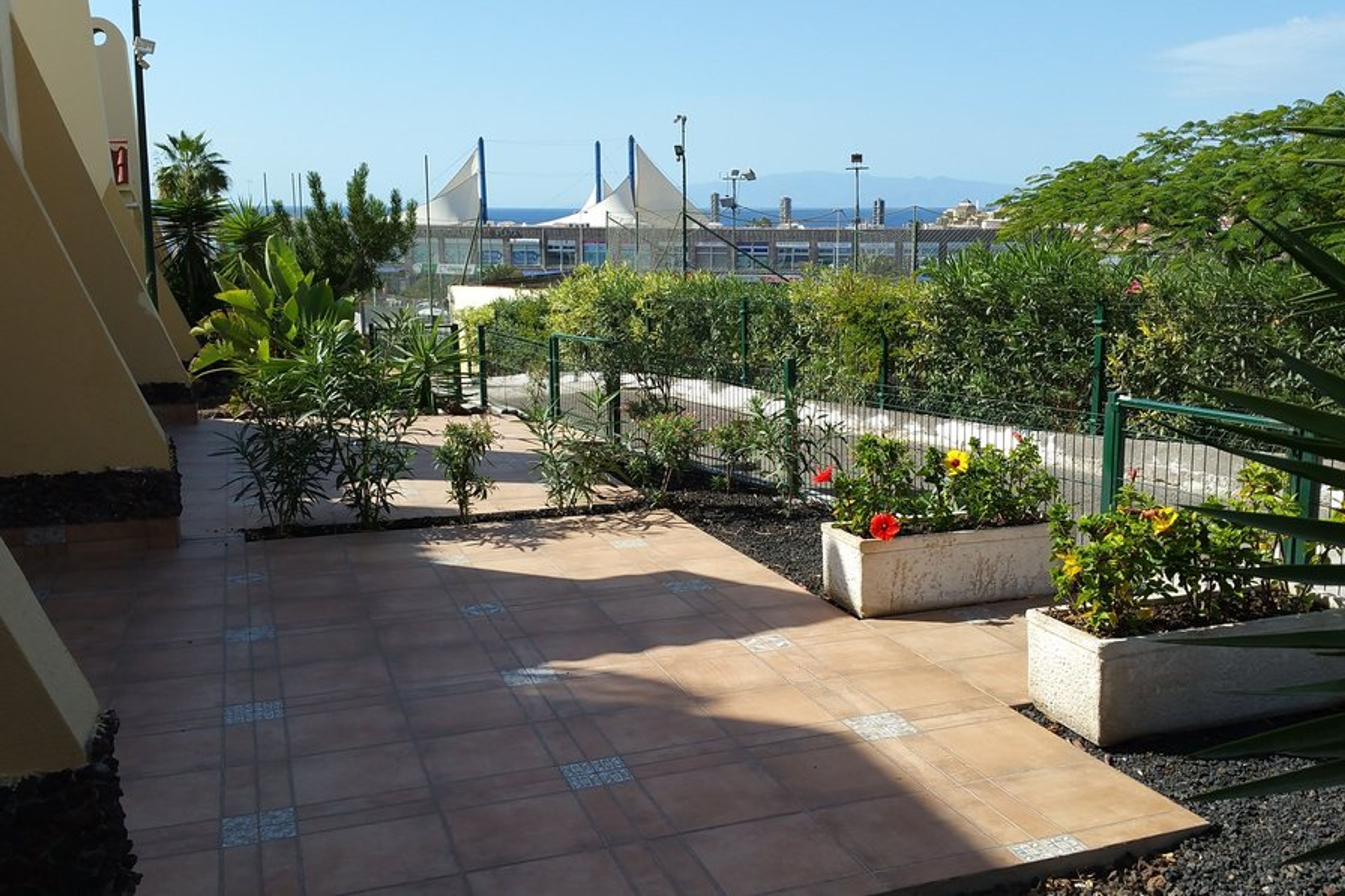 Outer patio with sea sunset and panoramic mountain vista.