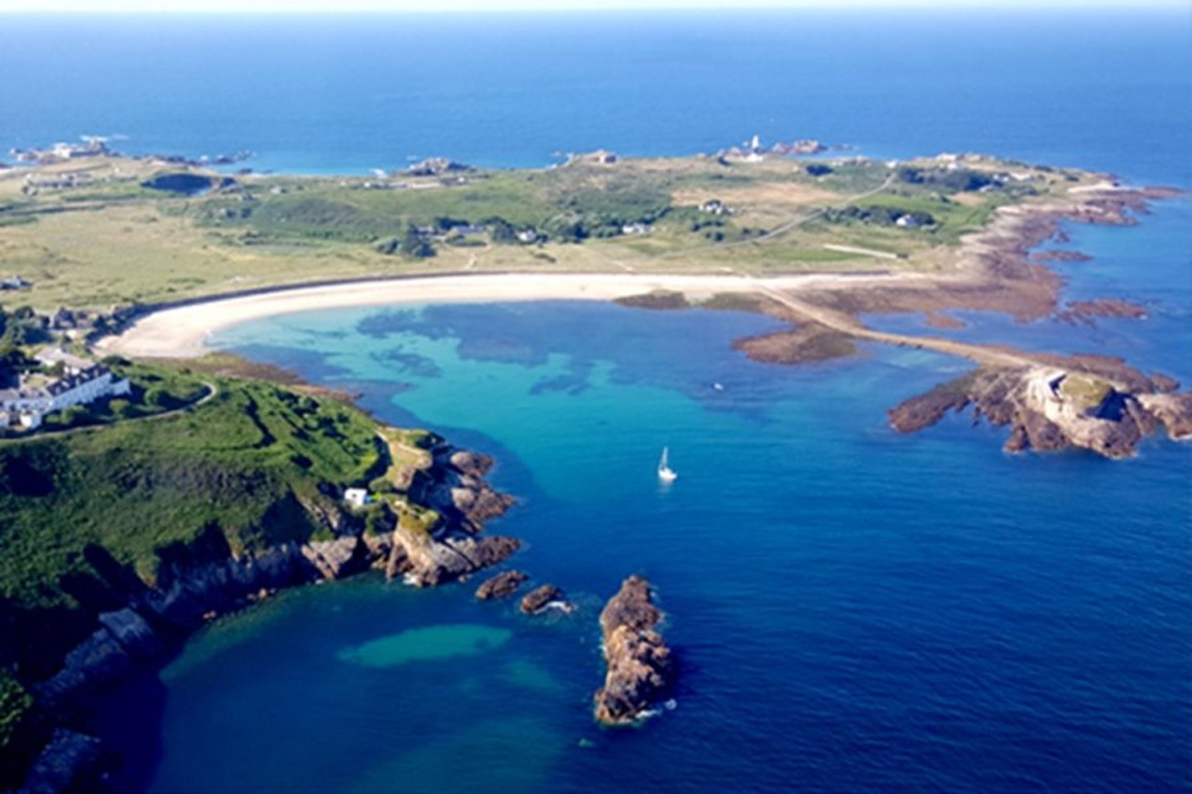 Longis Bay showing Fort Raz and Les Pourciaux Cottage
