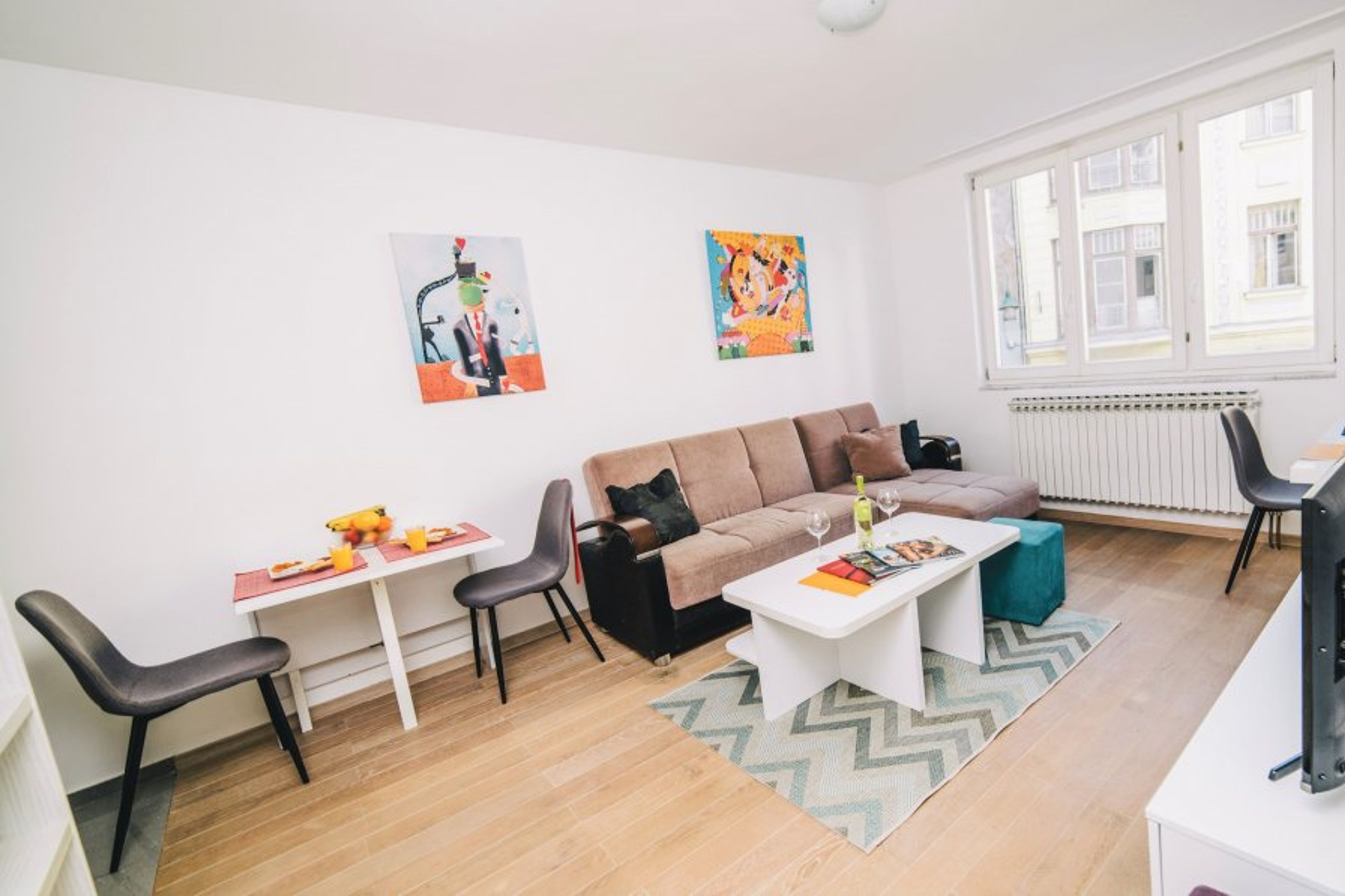 The modern and spacious living room with a comfortable double sofa bed