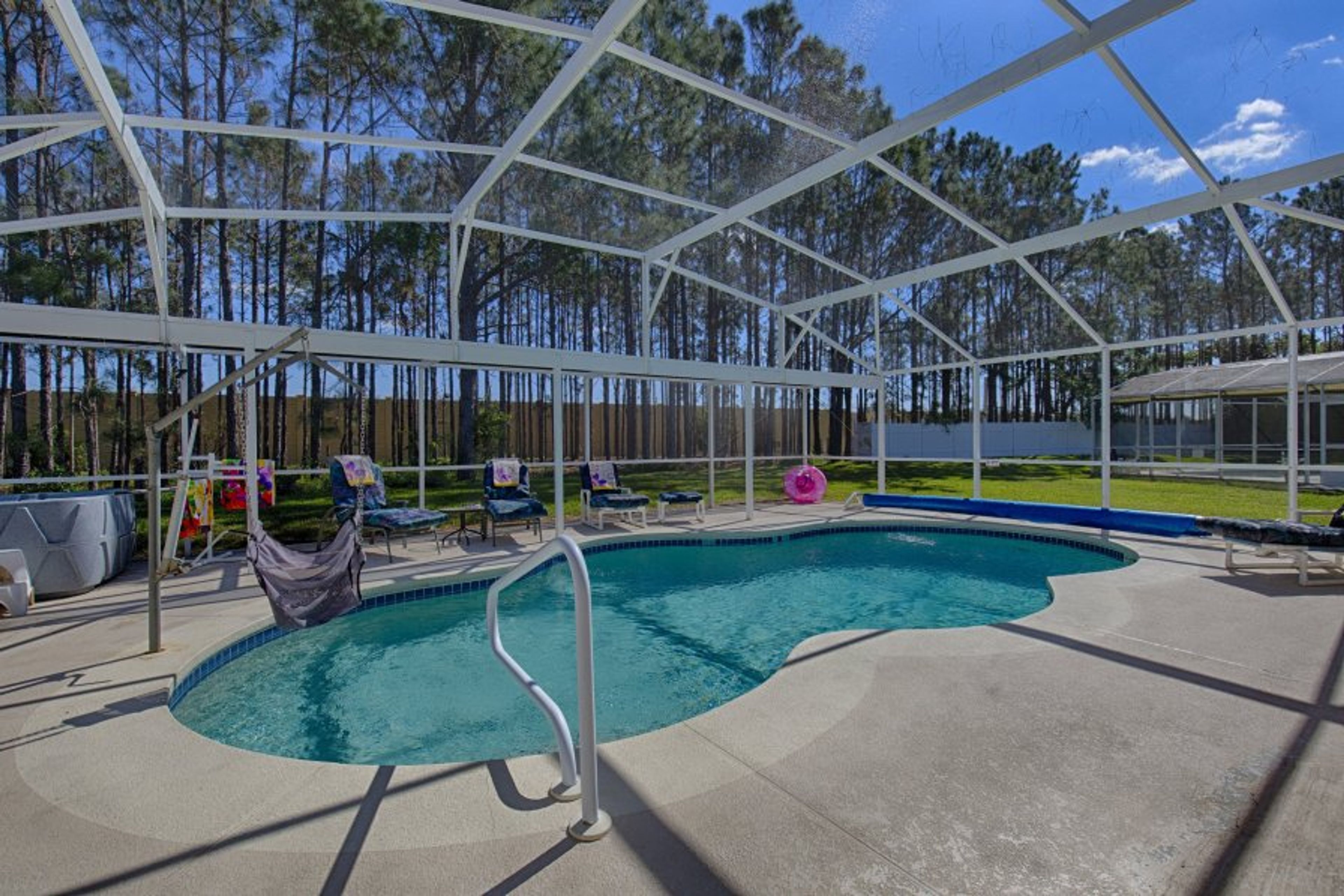 Vacation Mode activated - loads of family fun in screened pool