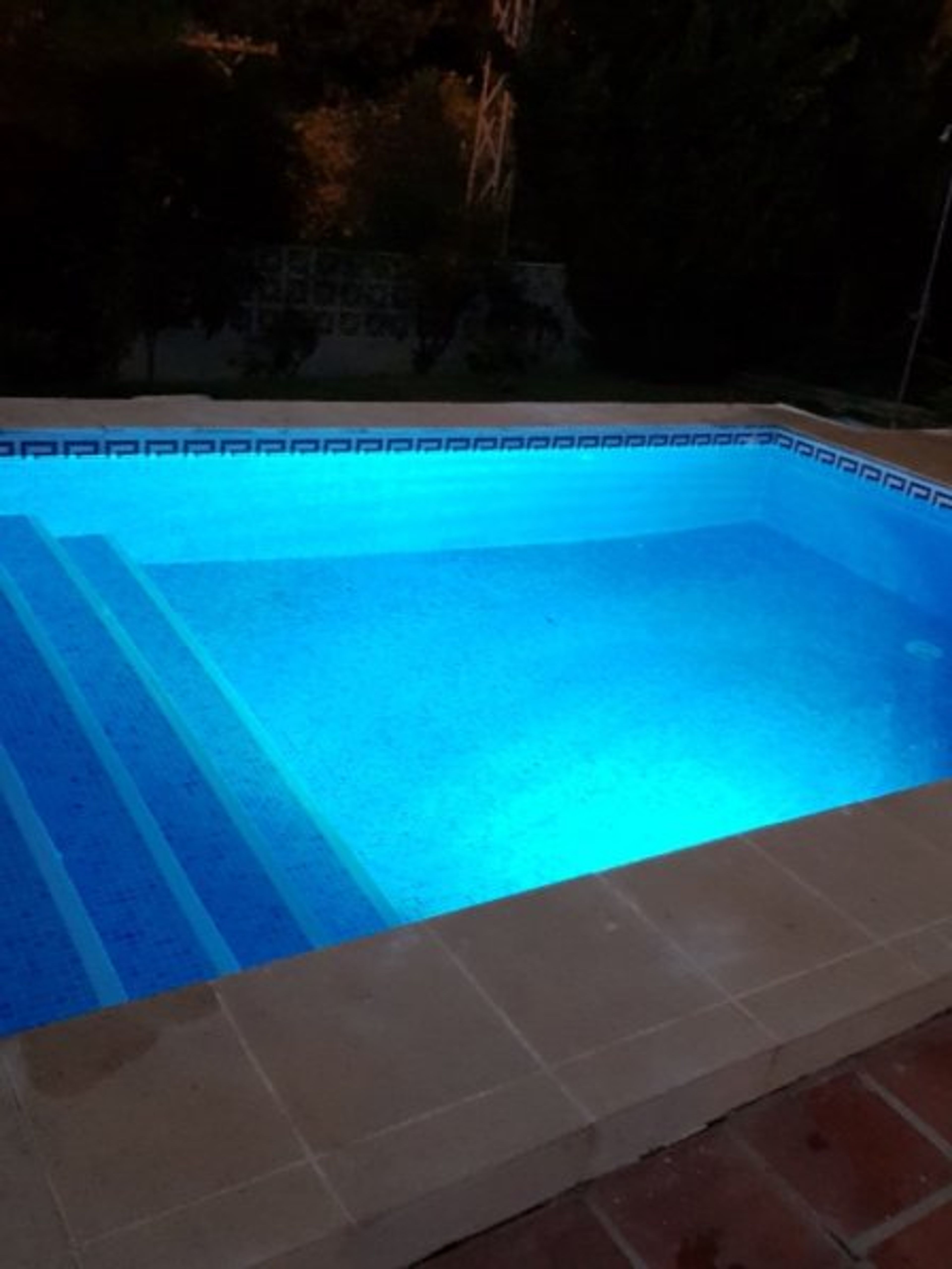 Heated pool with lighting perfect for a night time swim 