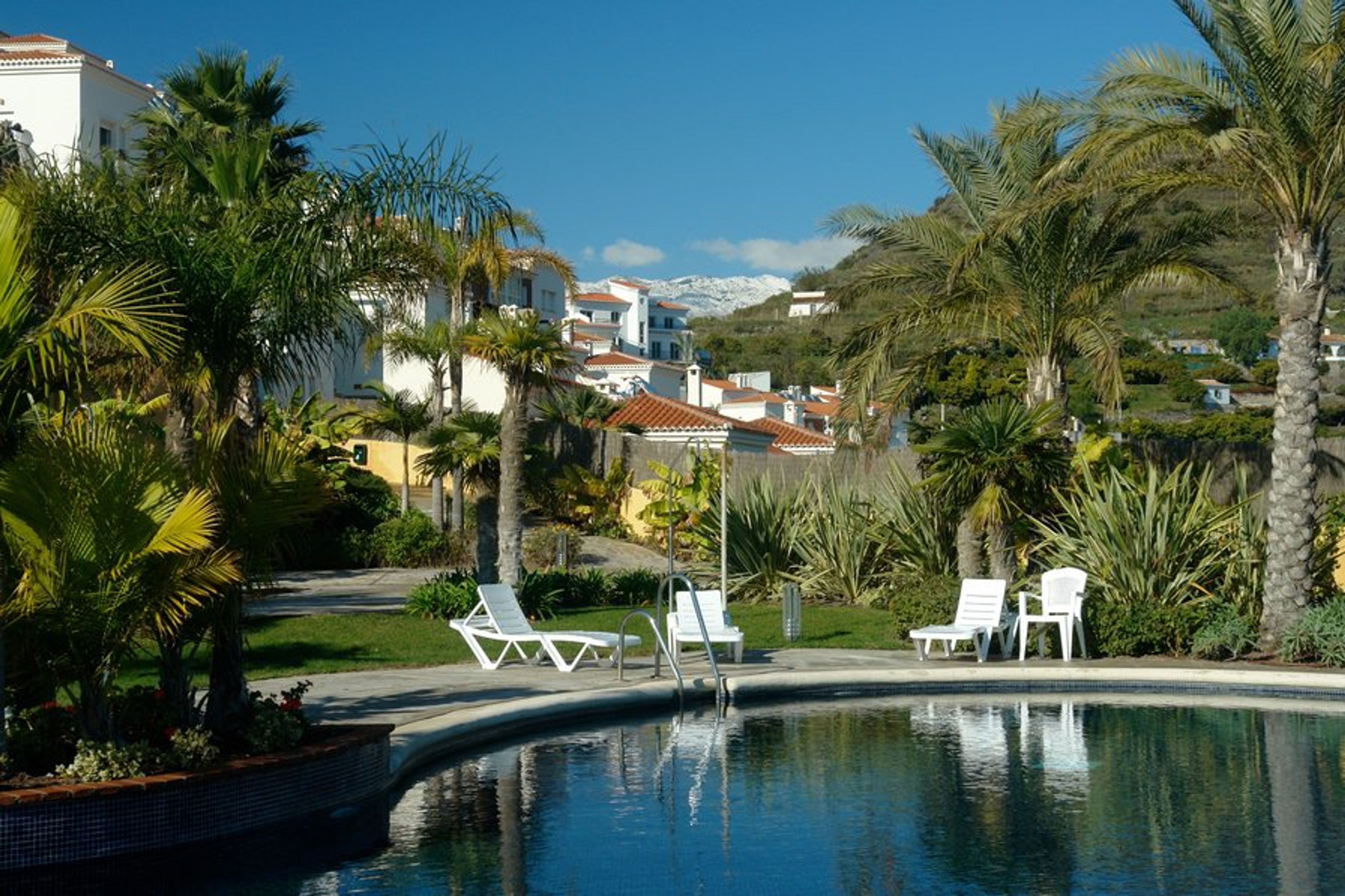 Infinity Pool with background of snow-capped peaks