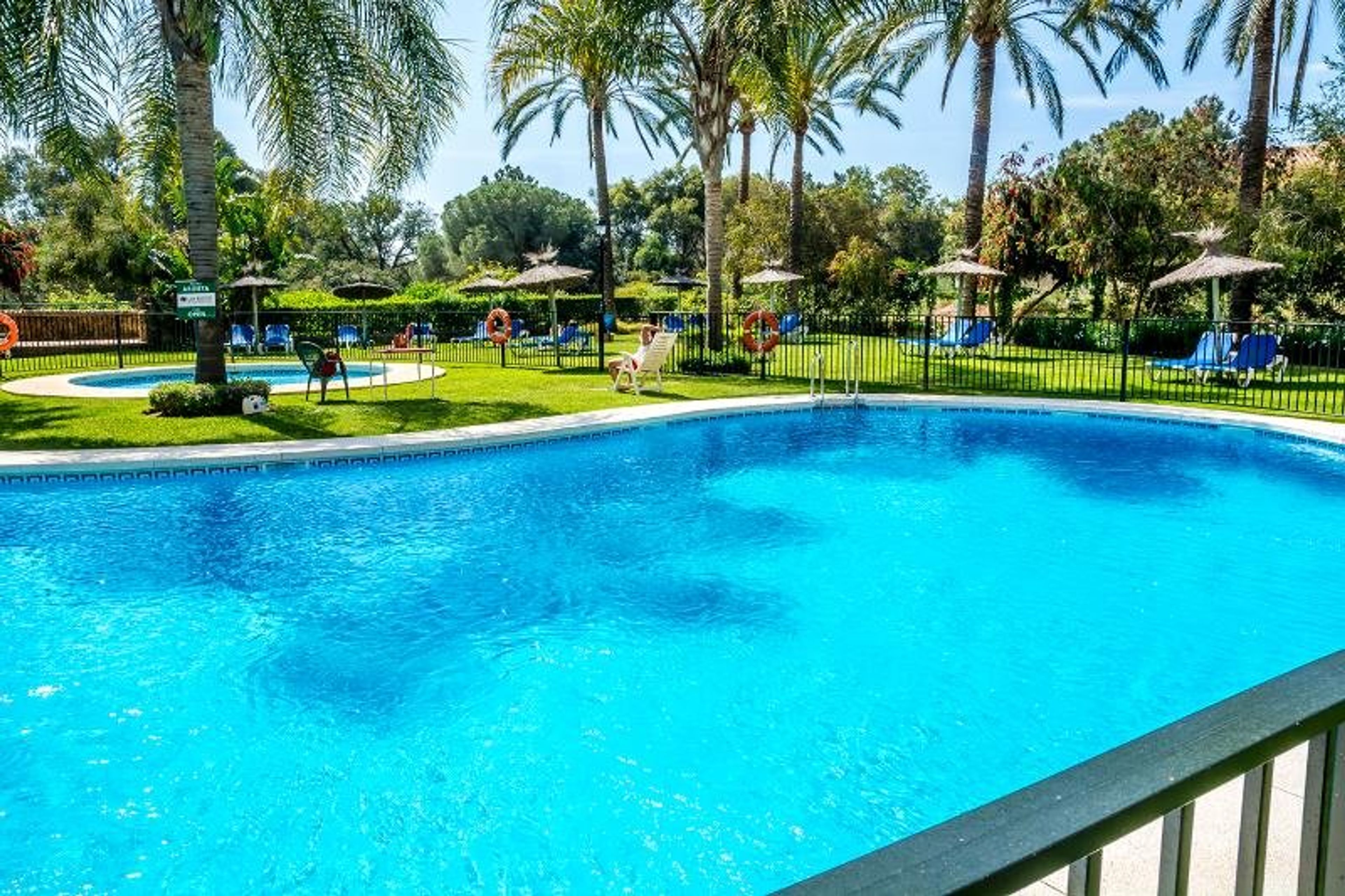 View of downstairs pool and gardens from your patio