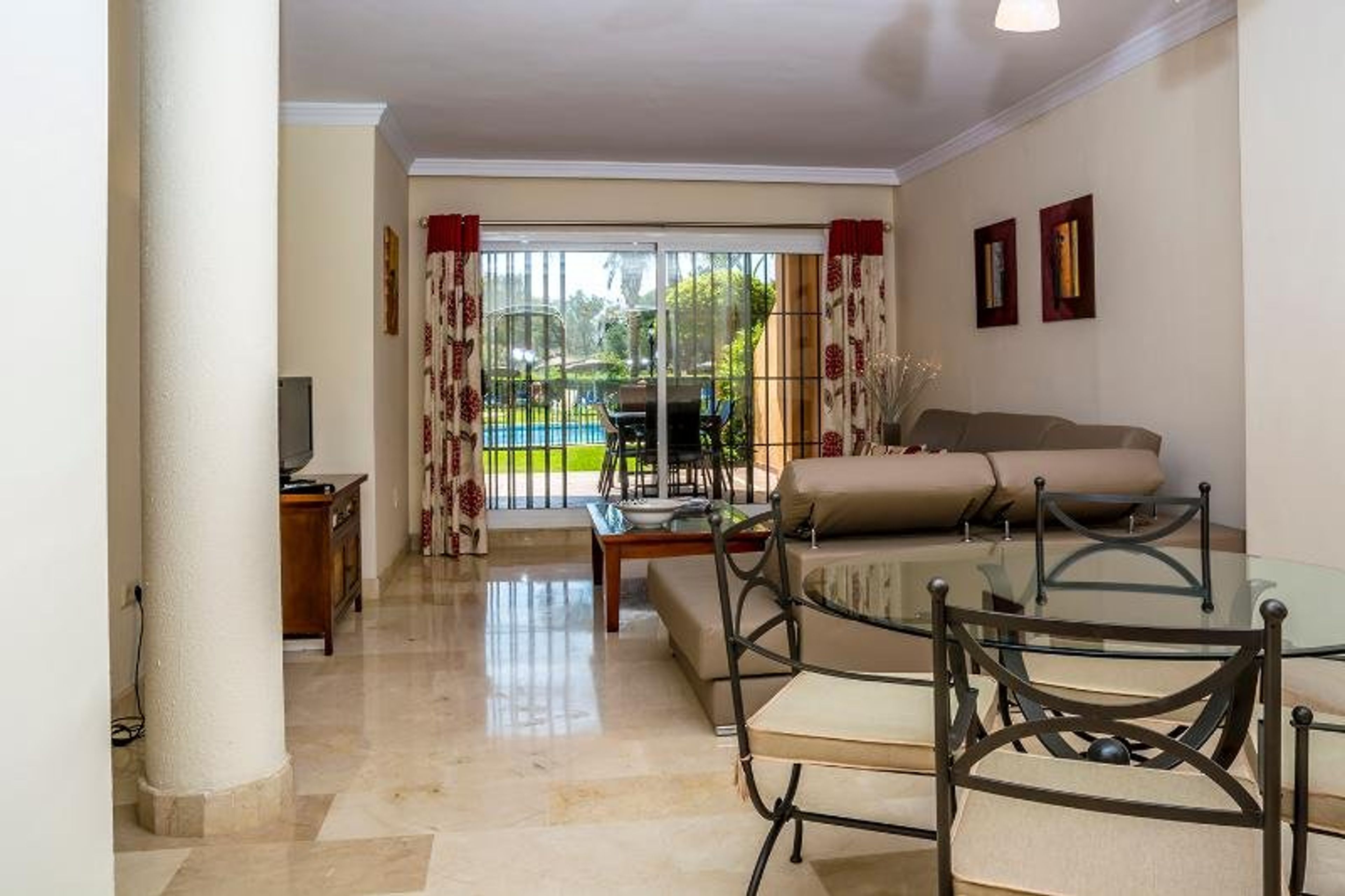 View of lounge area from kitchen. Security shutters can fully open