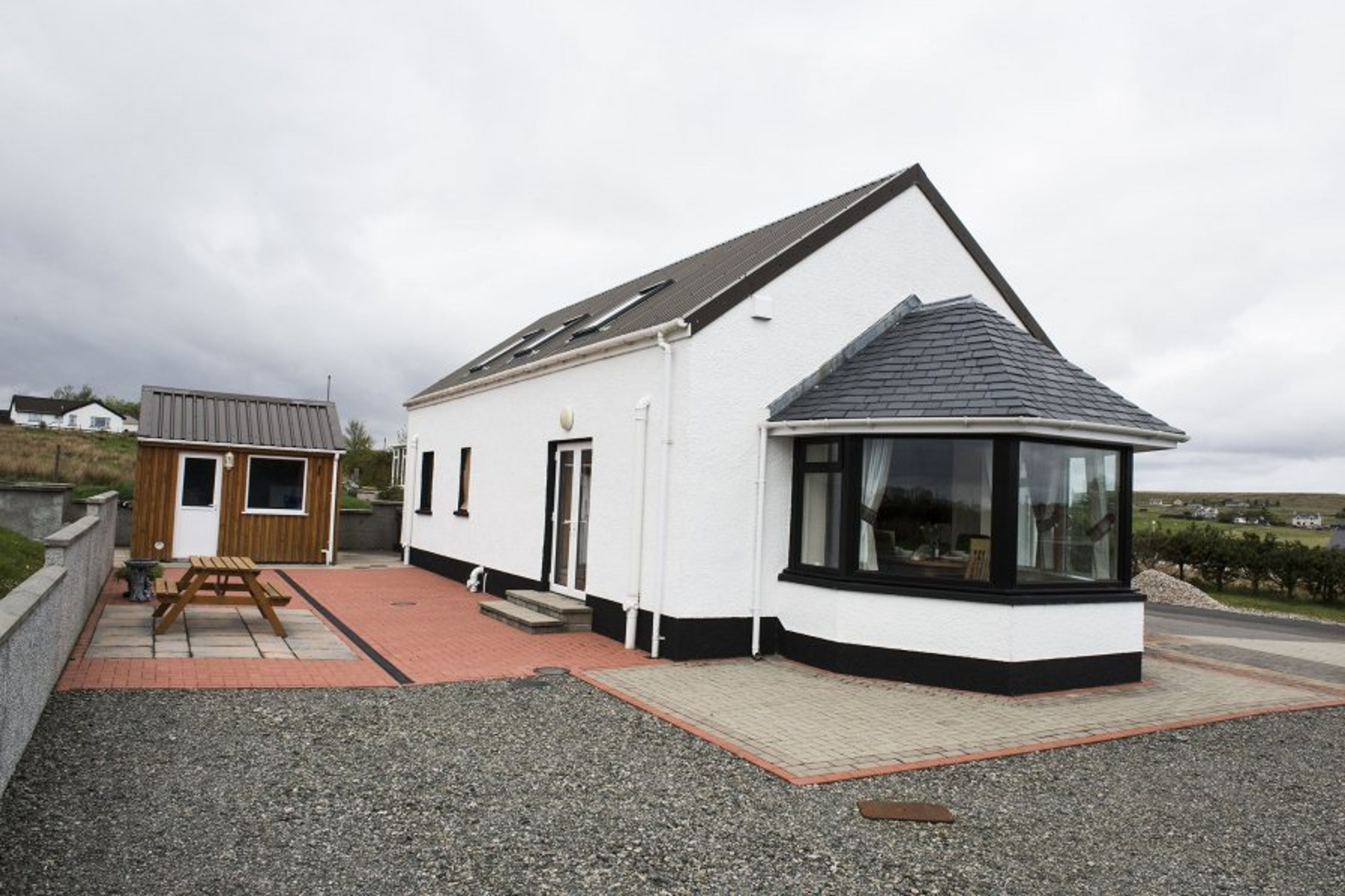 Rear of cottage with patio area.