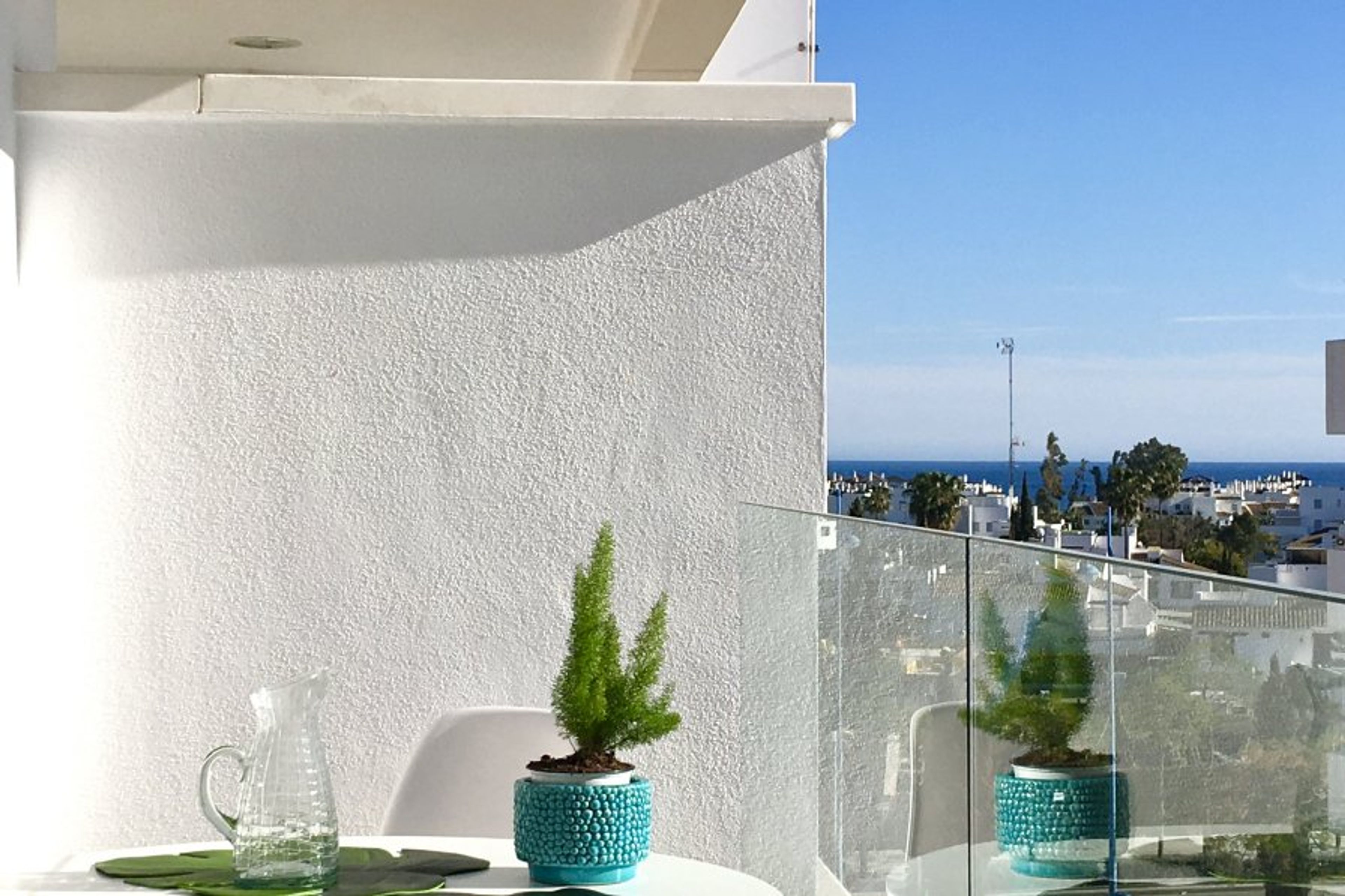 Enjoy the terrace with views to the sea and pool