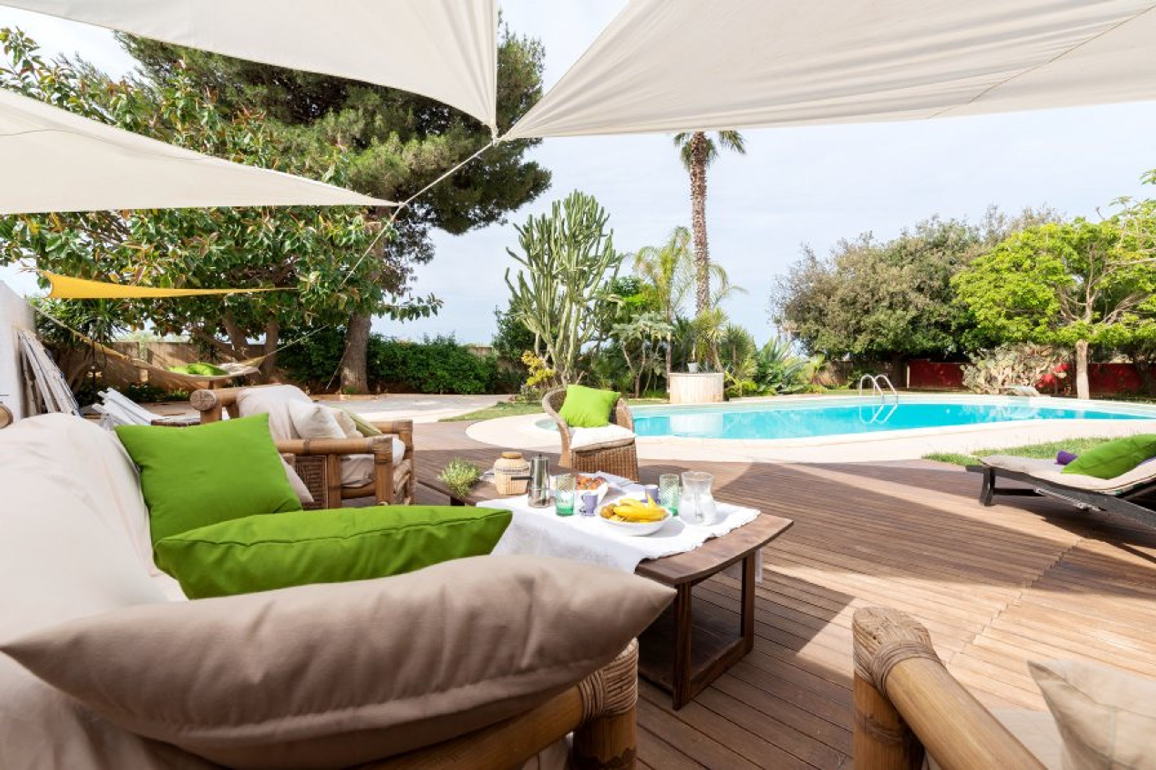 OutdoorSolarium poolside, teack platters eucaliptus knurled.
