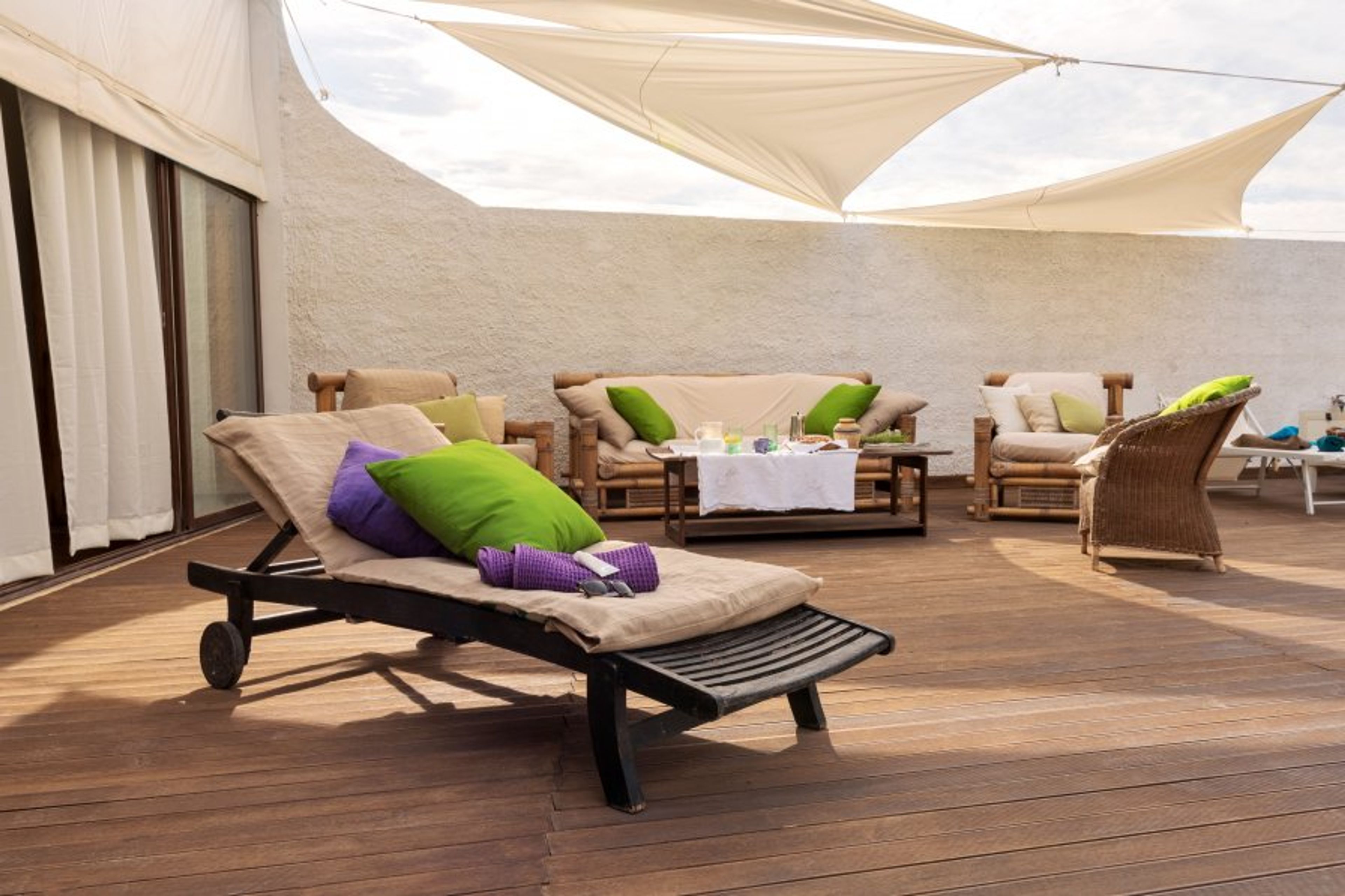 ExteriorSolarium in teack adjacent planks sliding glass enclosures