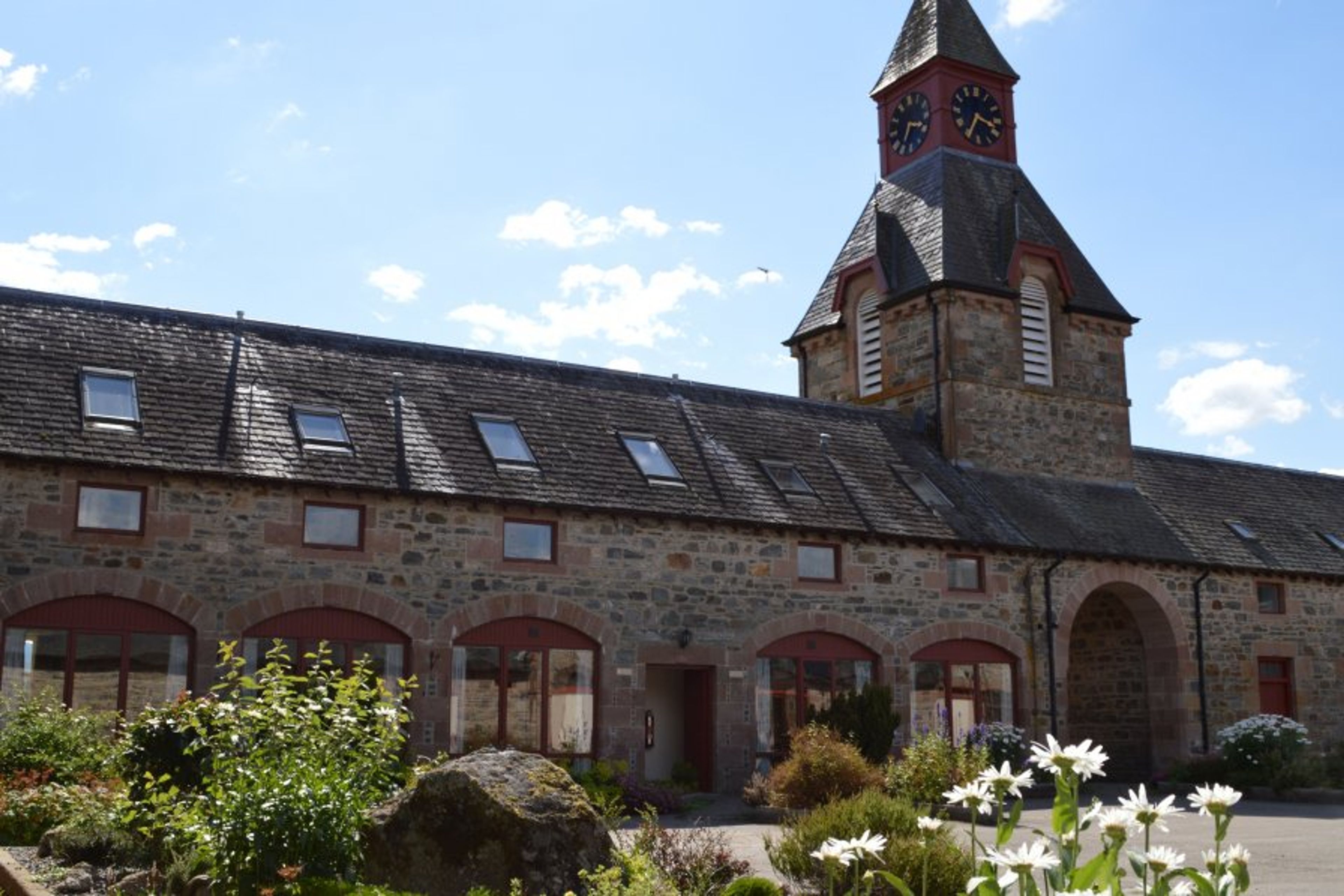 The entrance to the steading is below the impressive clock tower.
