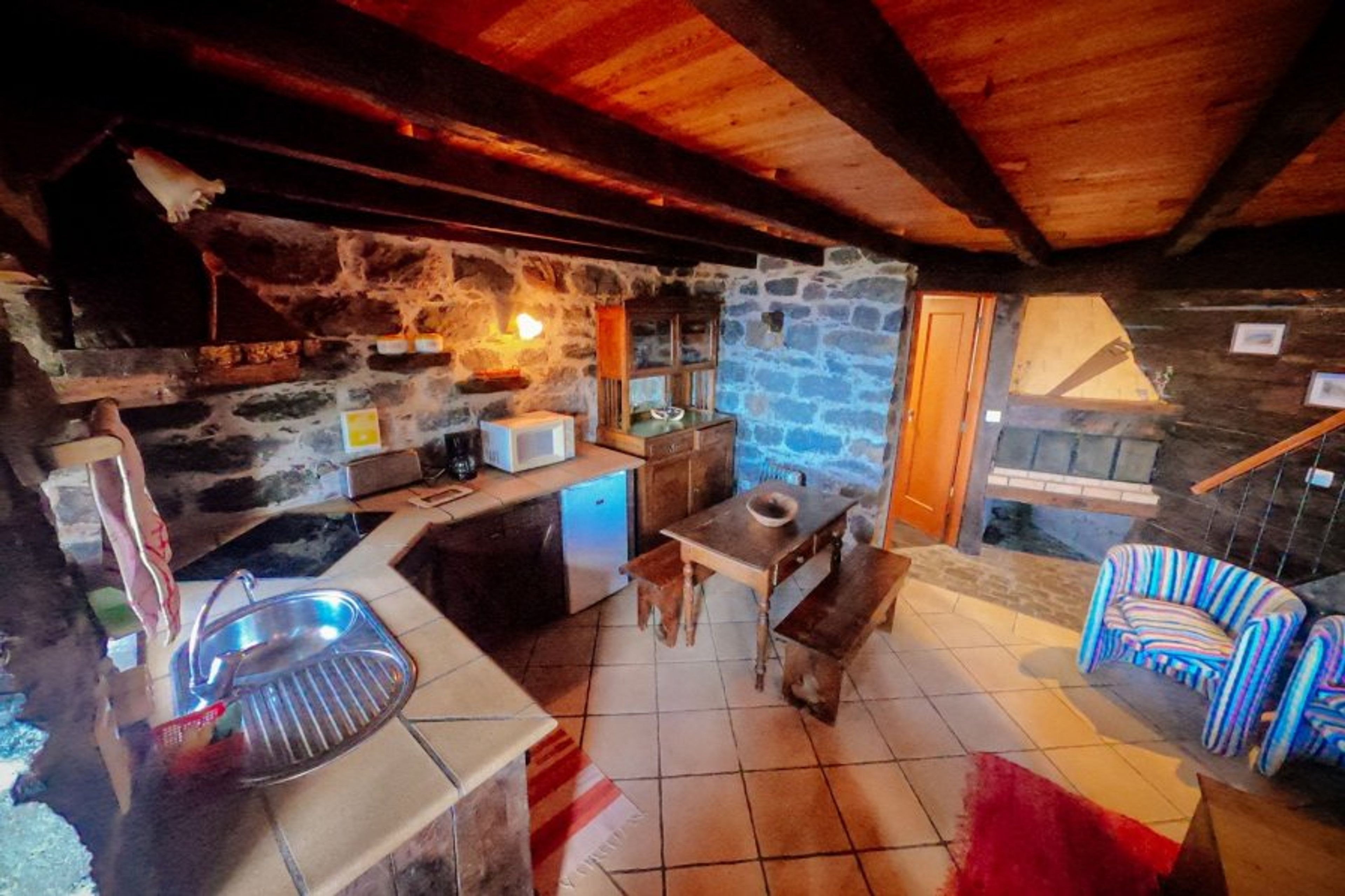 Bottom floor of cottage with kitchen and living area