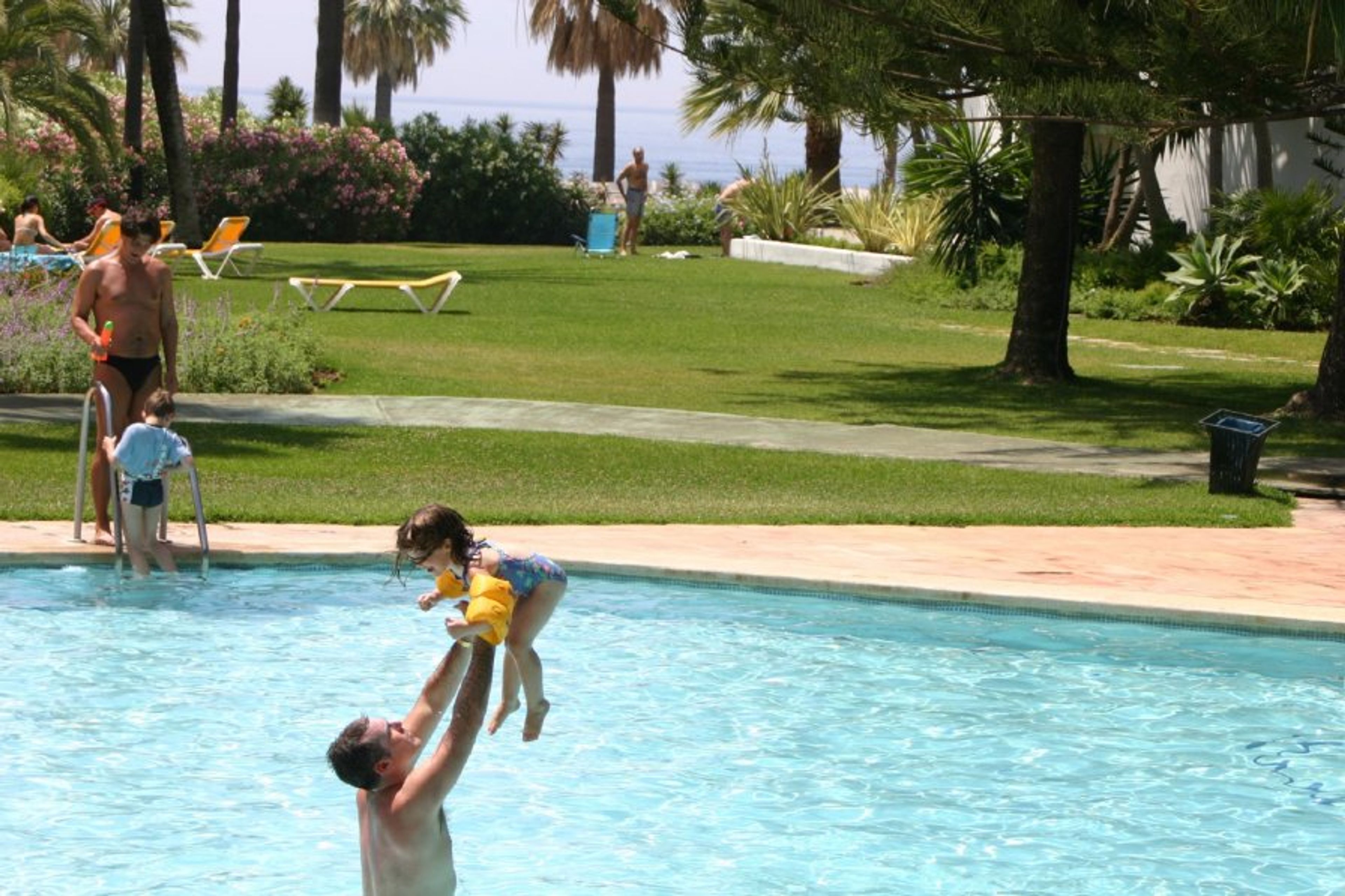 Family fun in 1 of 3 pools - the Mediterranean sea in the background