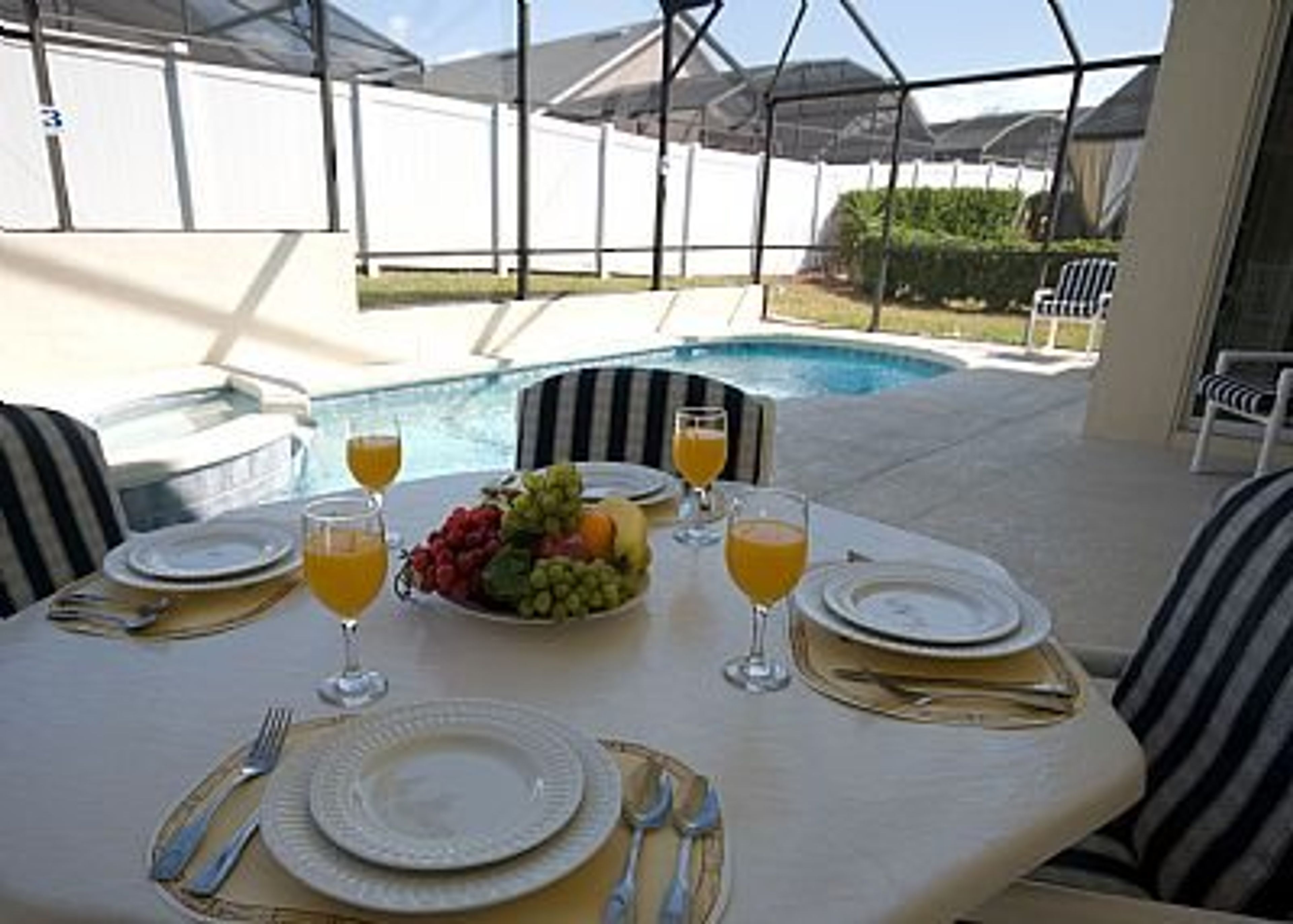 enjoy a meal on the fully furnished pool deck