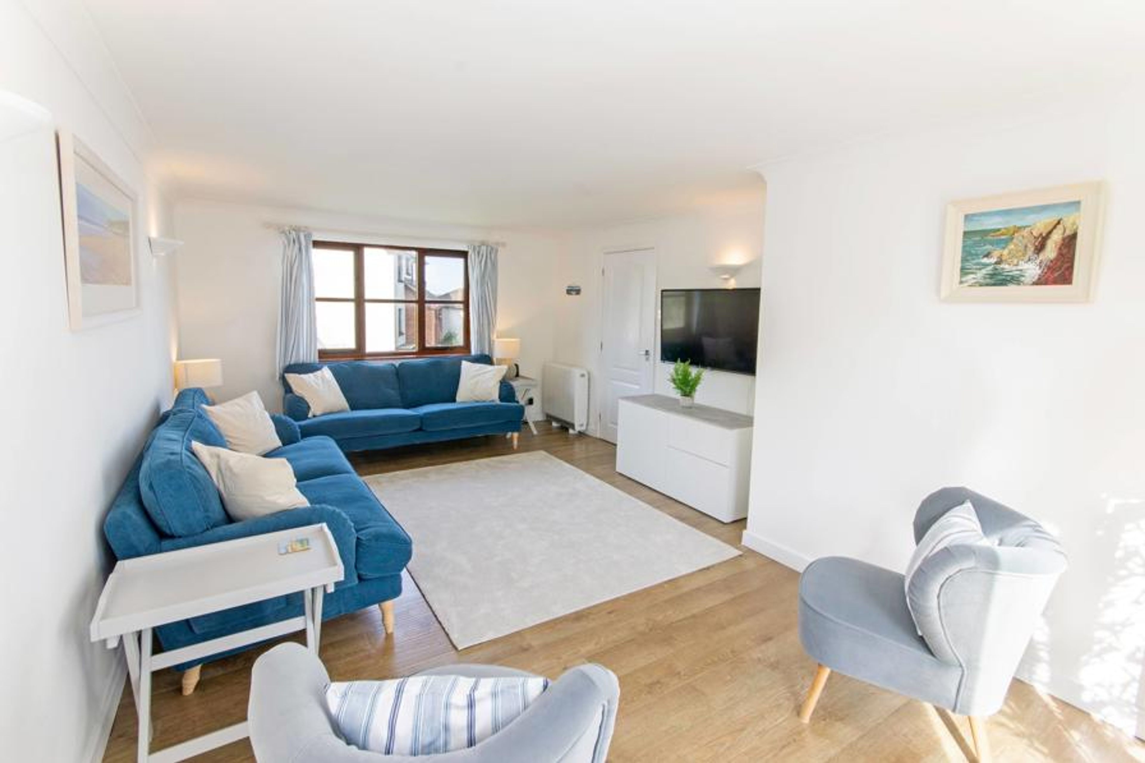 Airy and bright lounge with patio doors to terrace