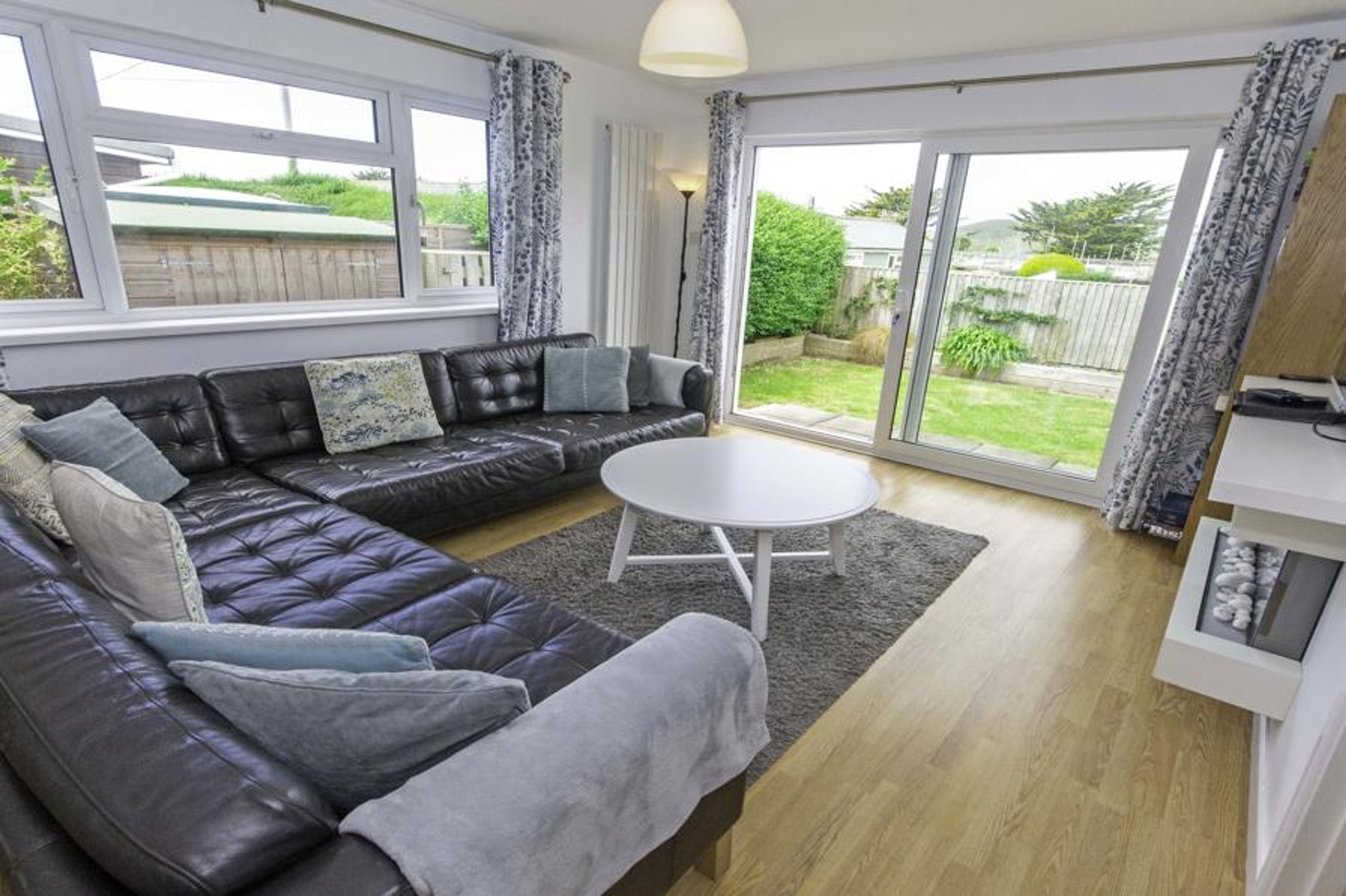 Lounge with patio doors leading to the garden