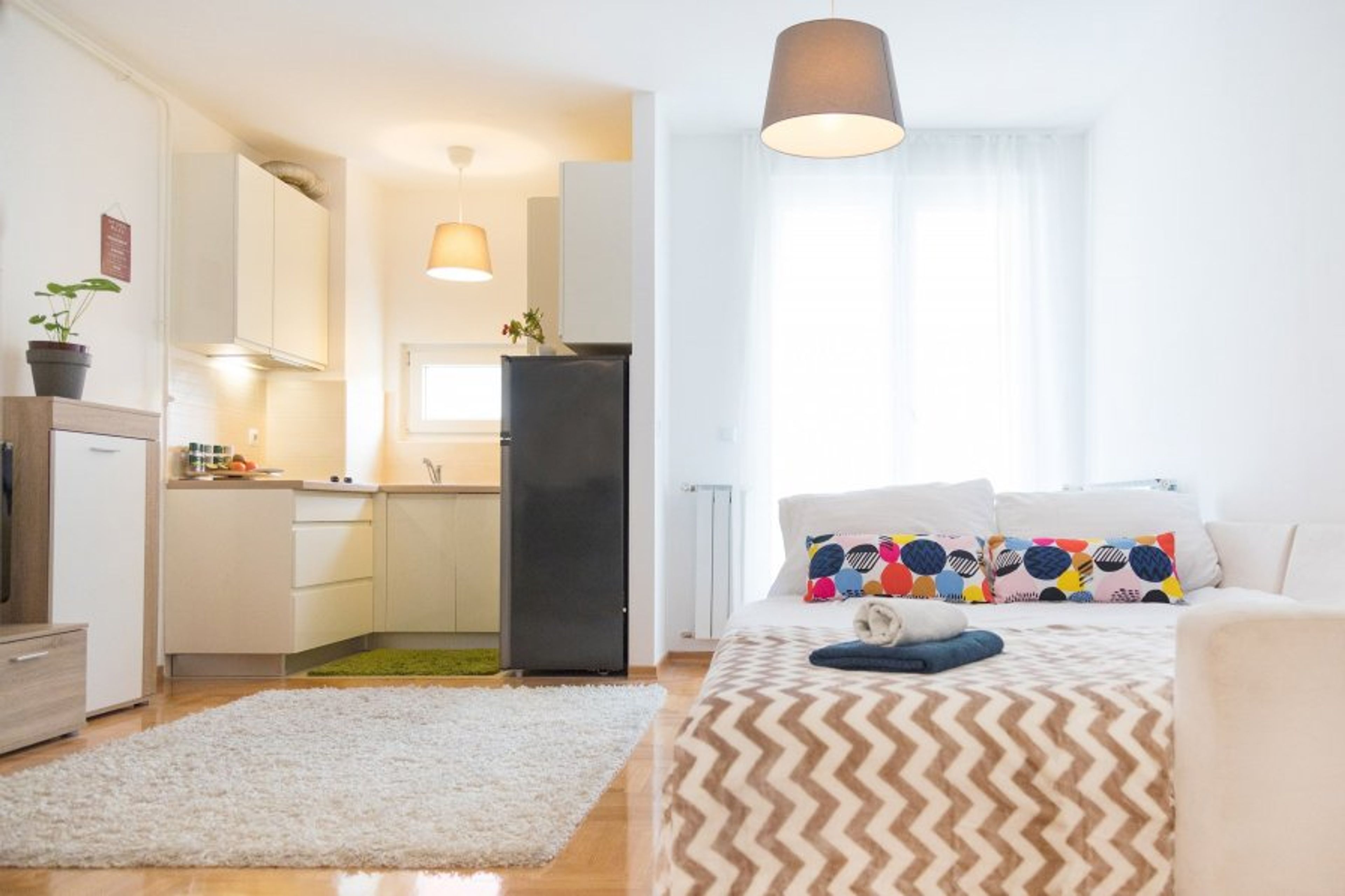 Super comftorable sofa bed with fully equipped kitchen in the background
