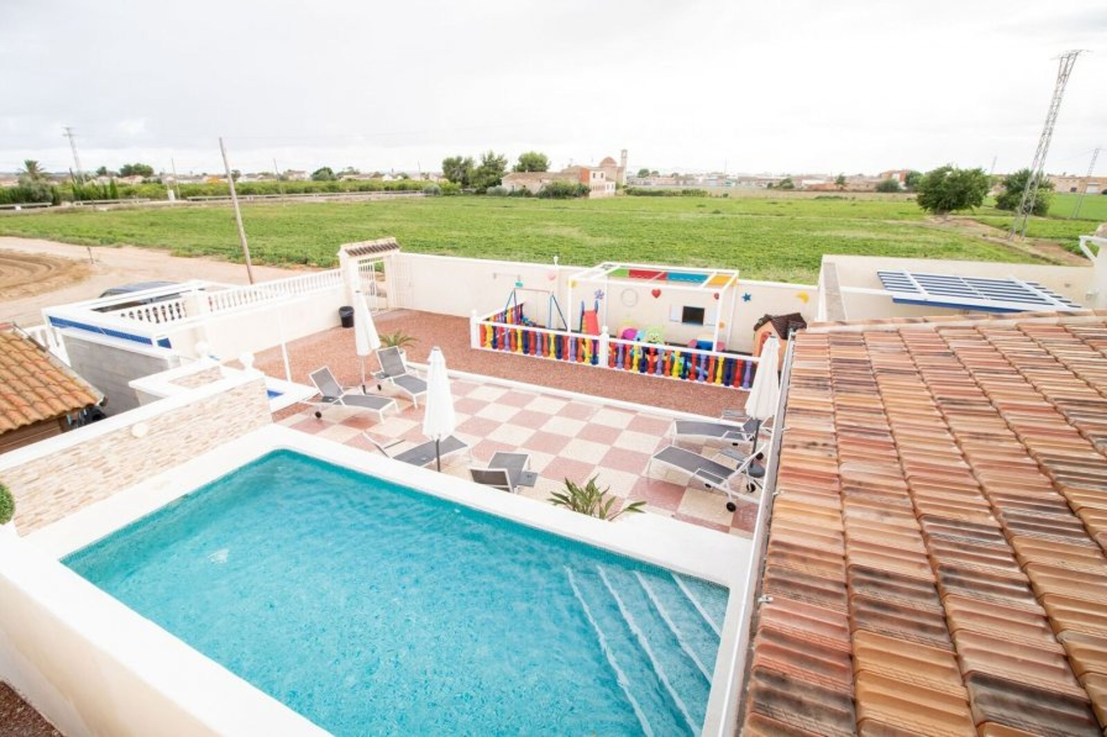 Country side view with Swimming pool and sun terrace view. 
