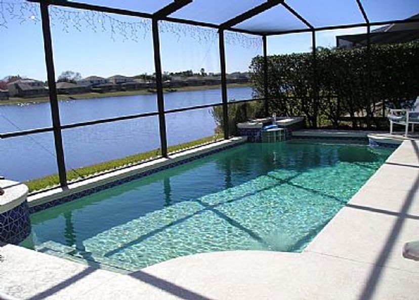 Villa in Sunset Lakes, Florida: Pool terrace has shrubs to both sides for privacy