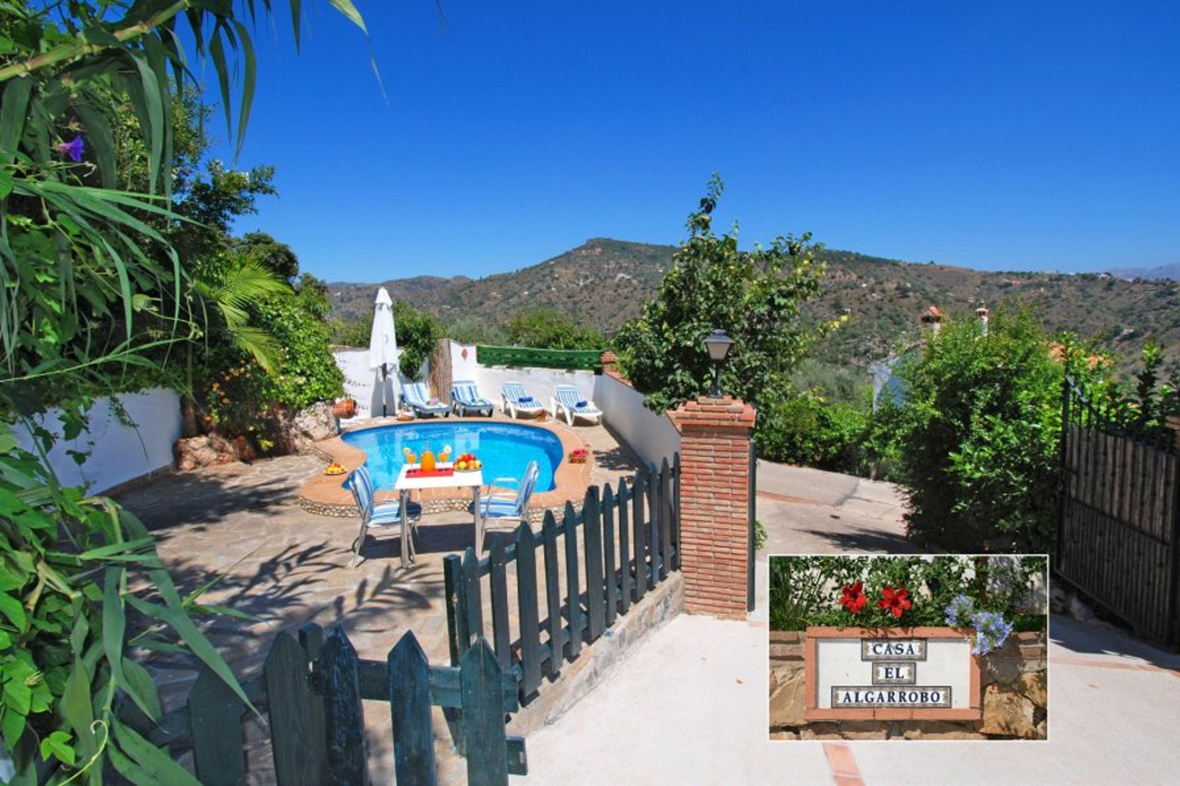 Entrance of the house and the swimming pool next to it.