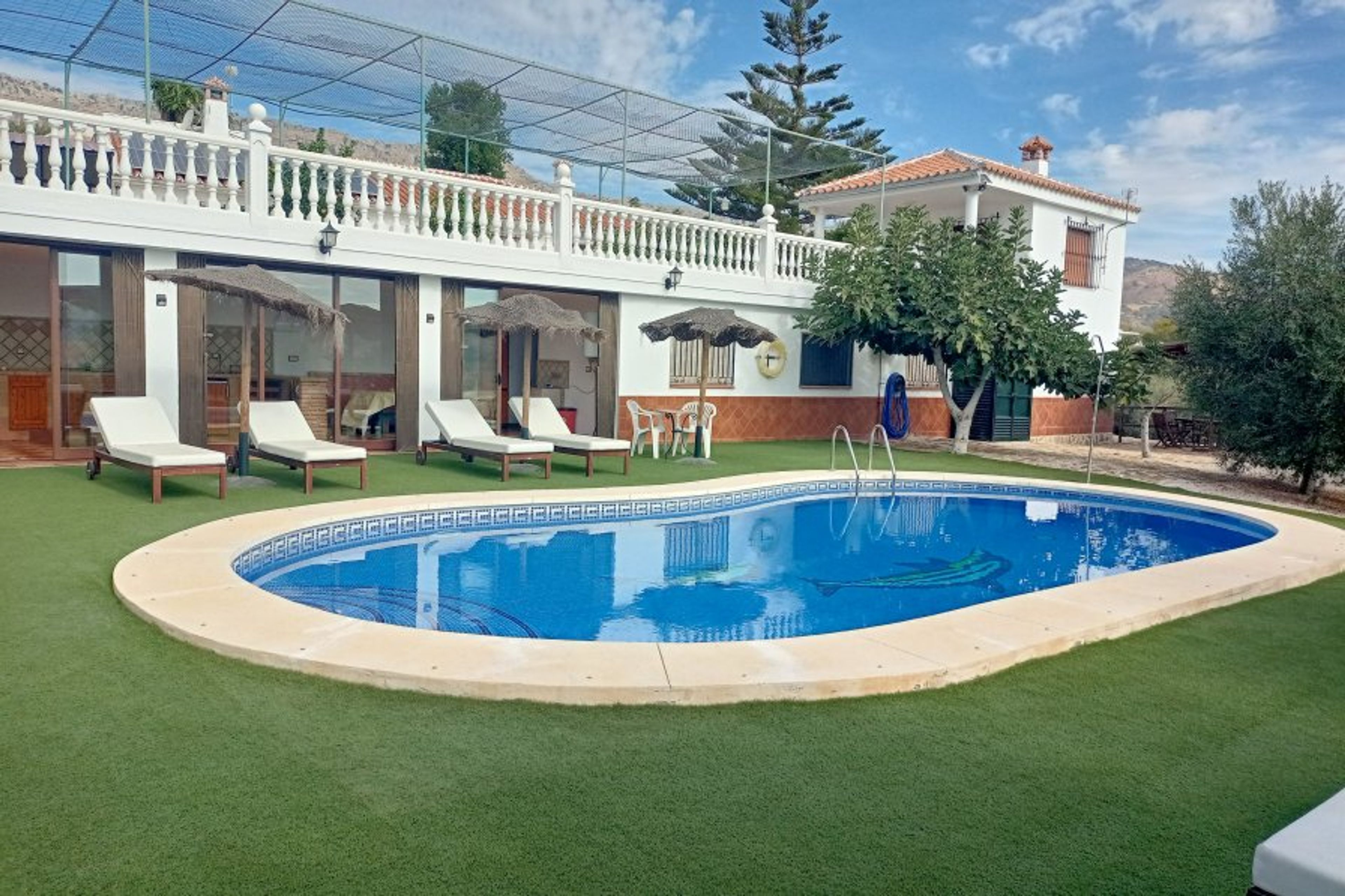 the pool area of Finca la Casilla, with the downstairs kitchen. 