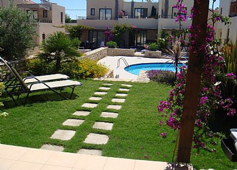 House in Chania region, Crete: View across garden to pool area
