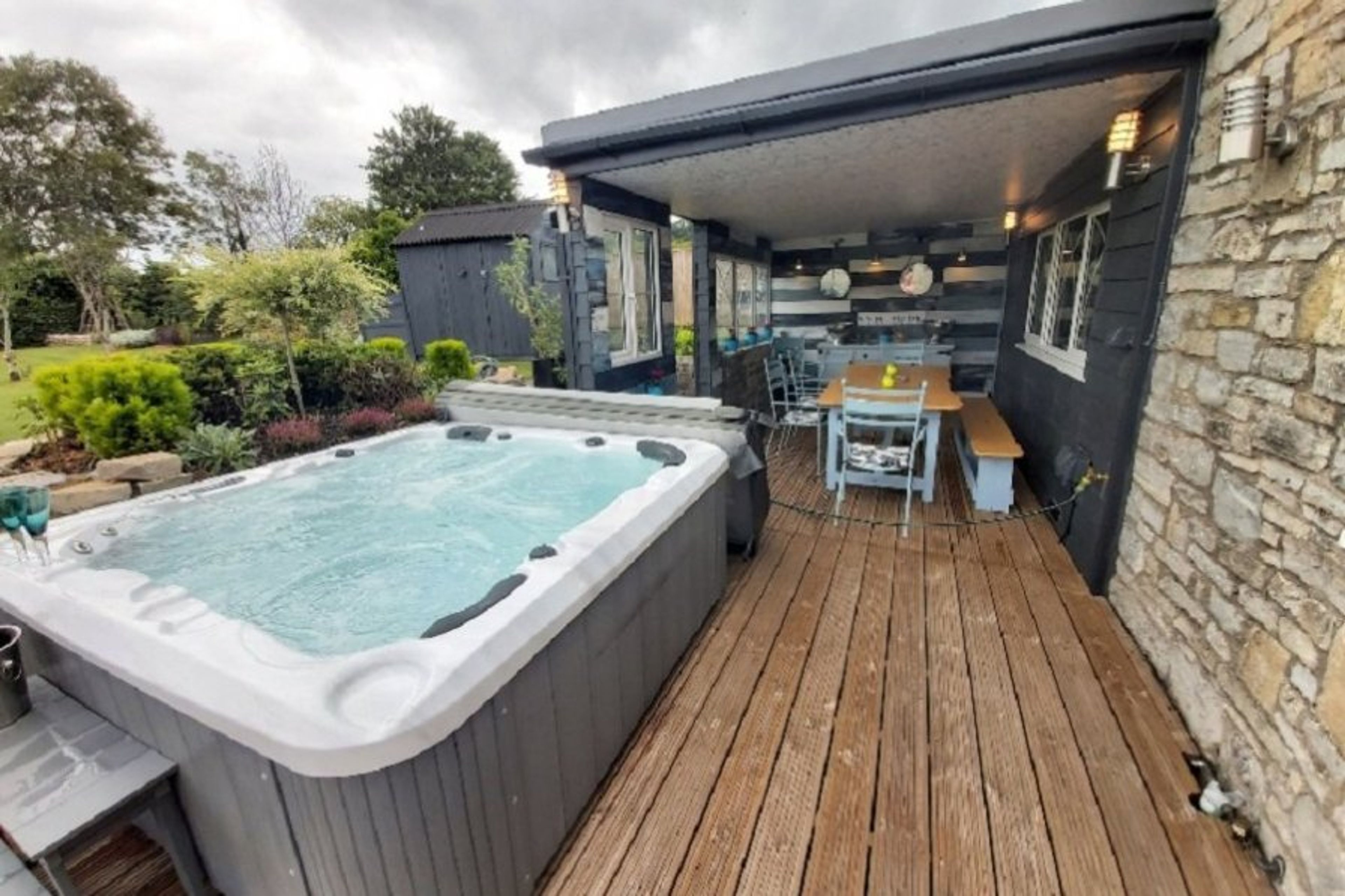 Outside the back door, nice and secluded hot tub and Alfresco dining.