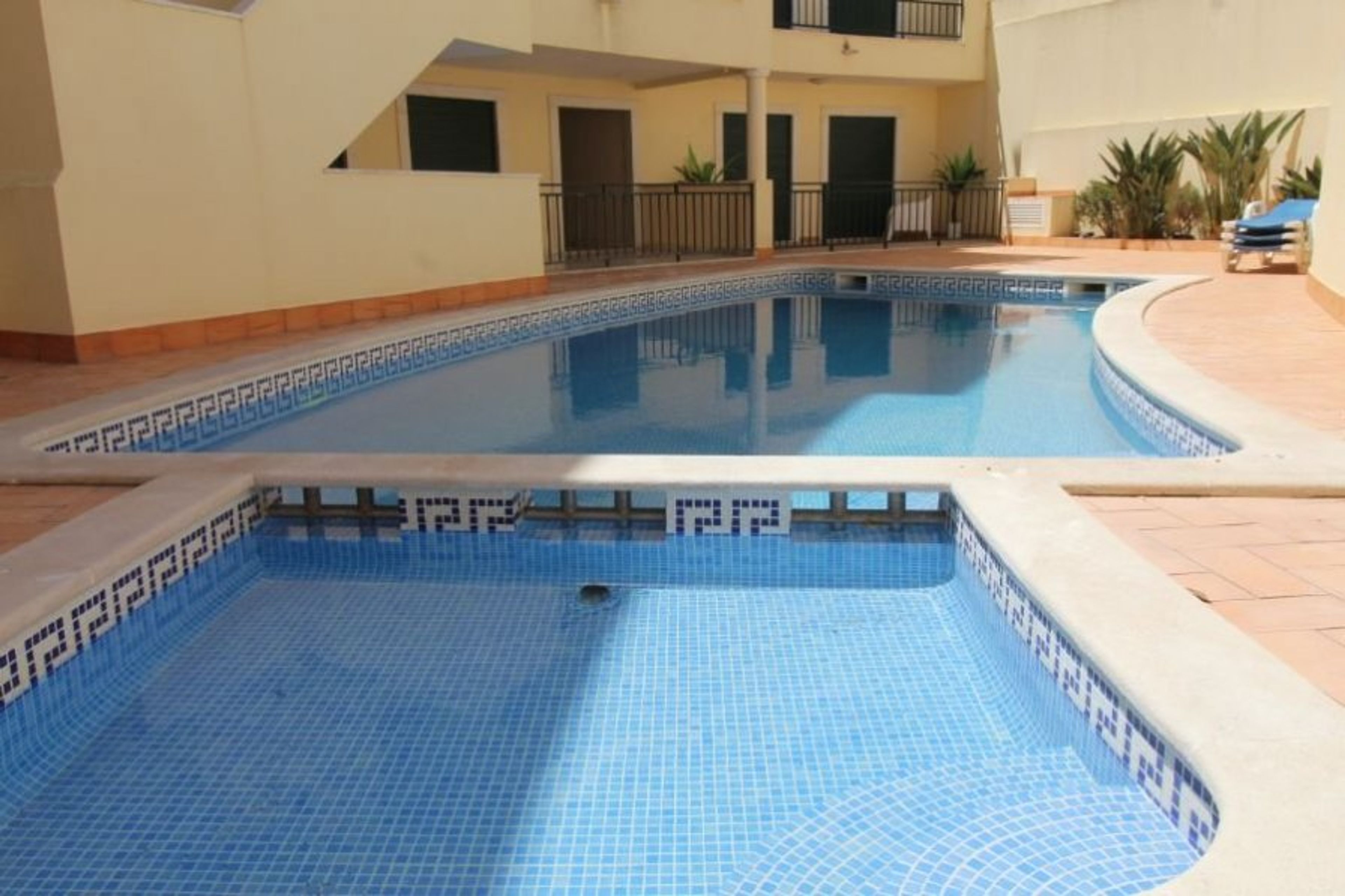 Shared pools with surrounding terrace
