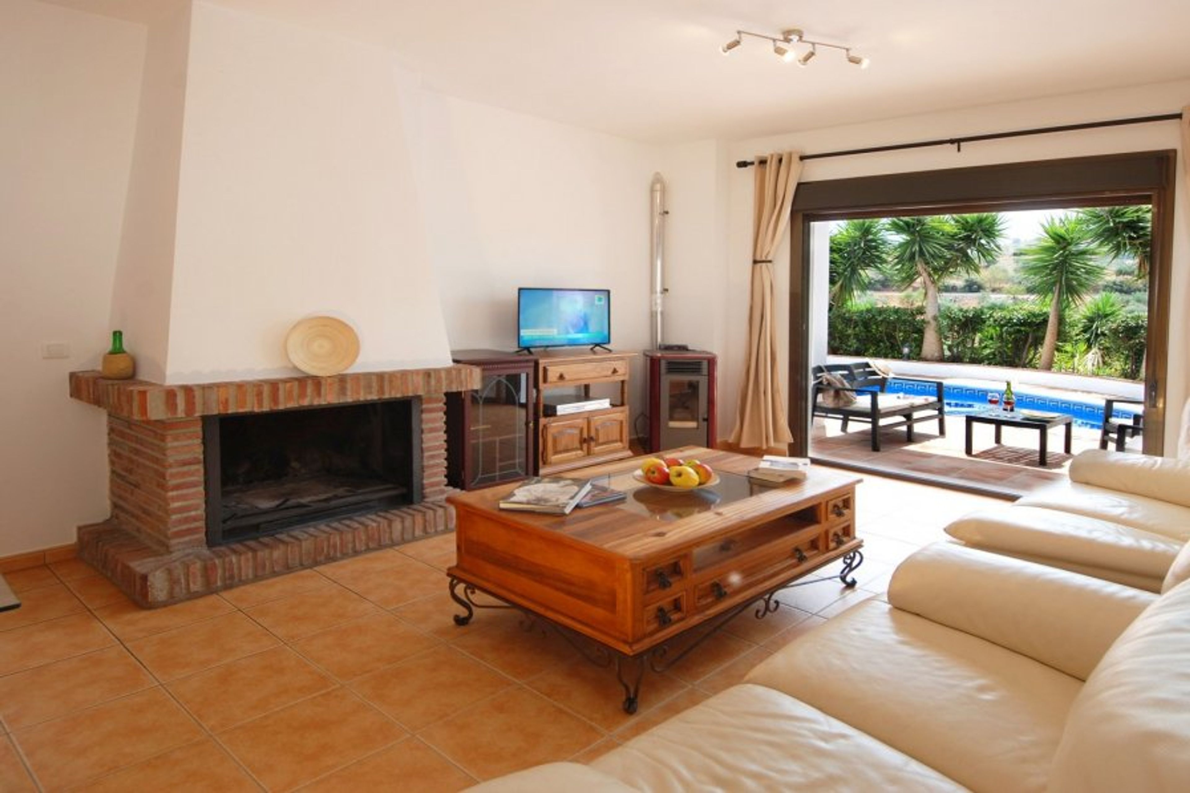 Beautiful, bright living room, leading directly to seating area. 