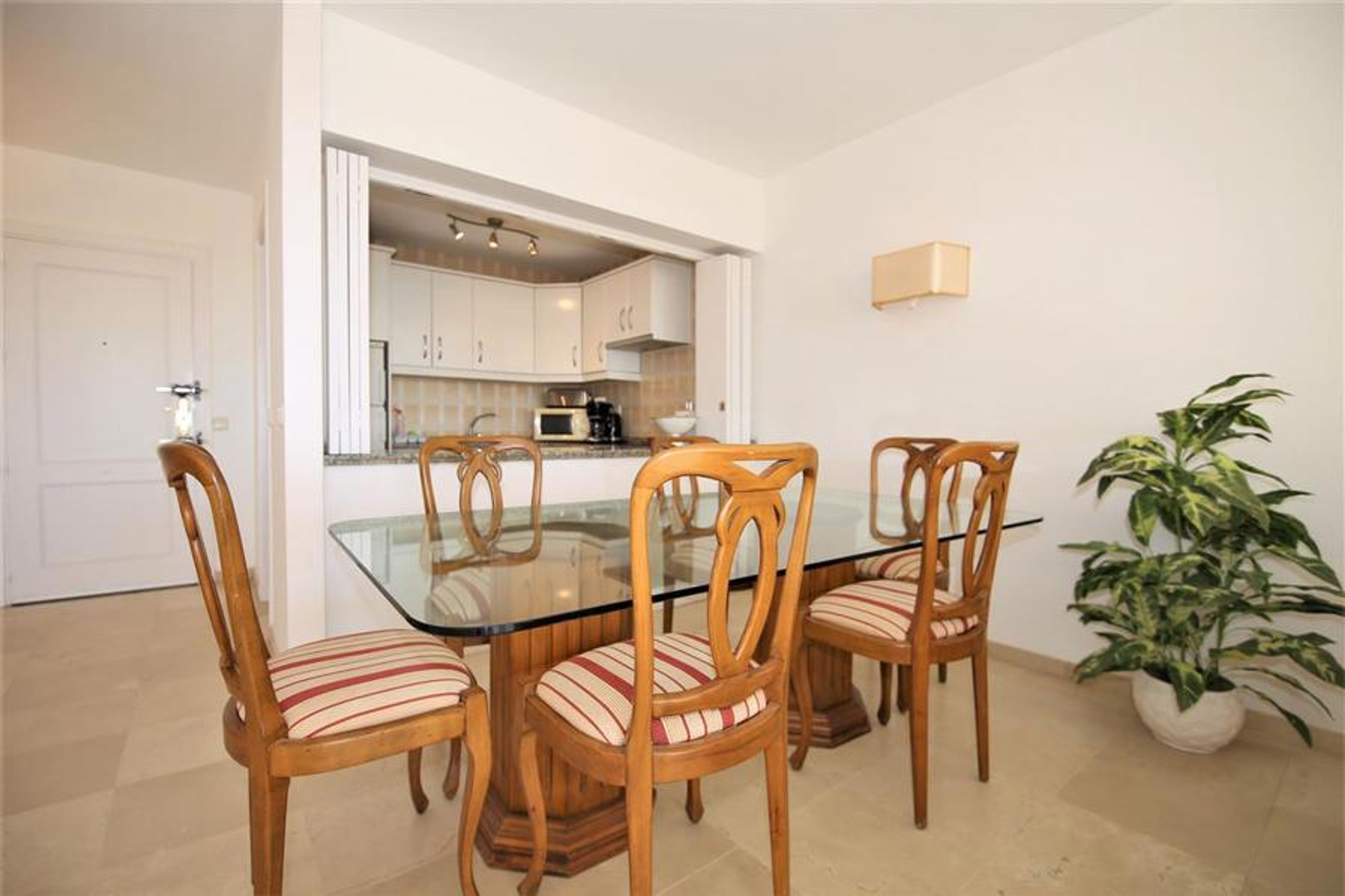 Dining area next to the kitchen with seating for s