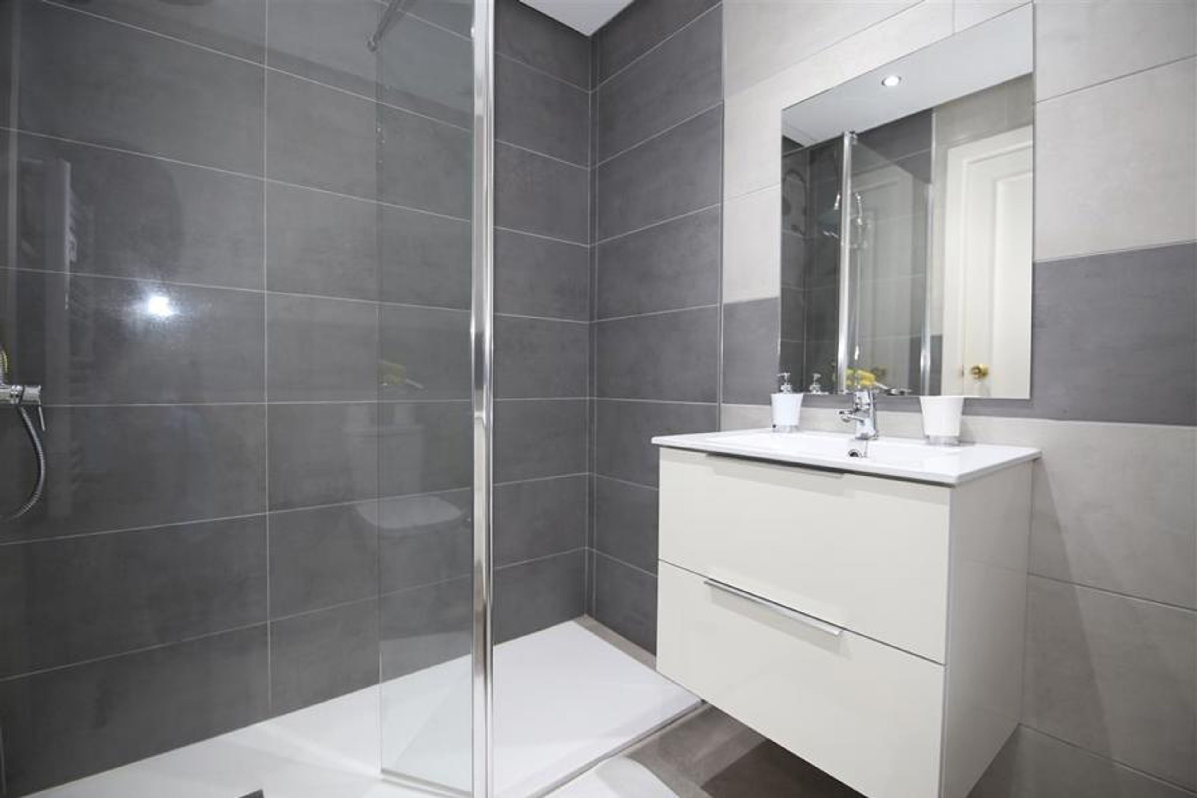 En-suite bathroom to the master bedroom with showe