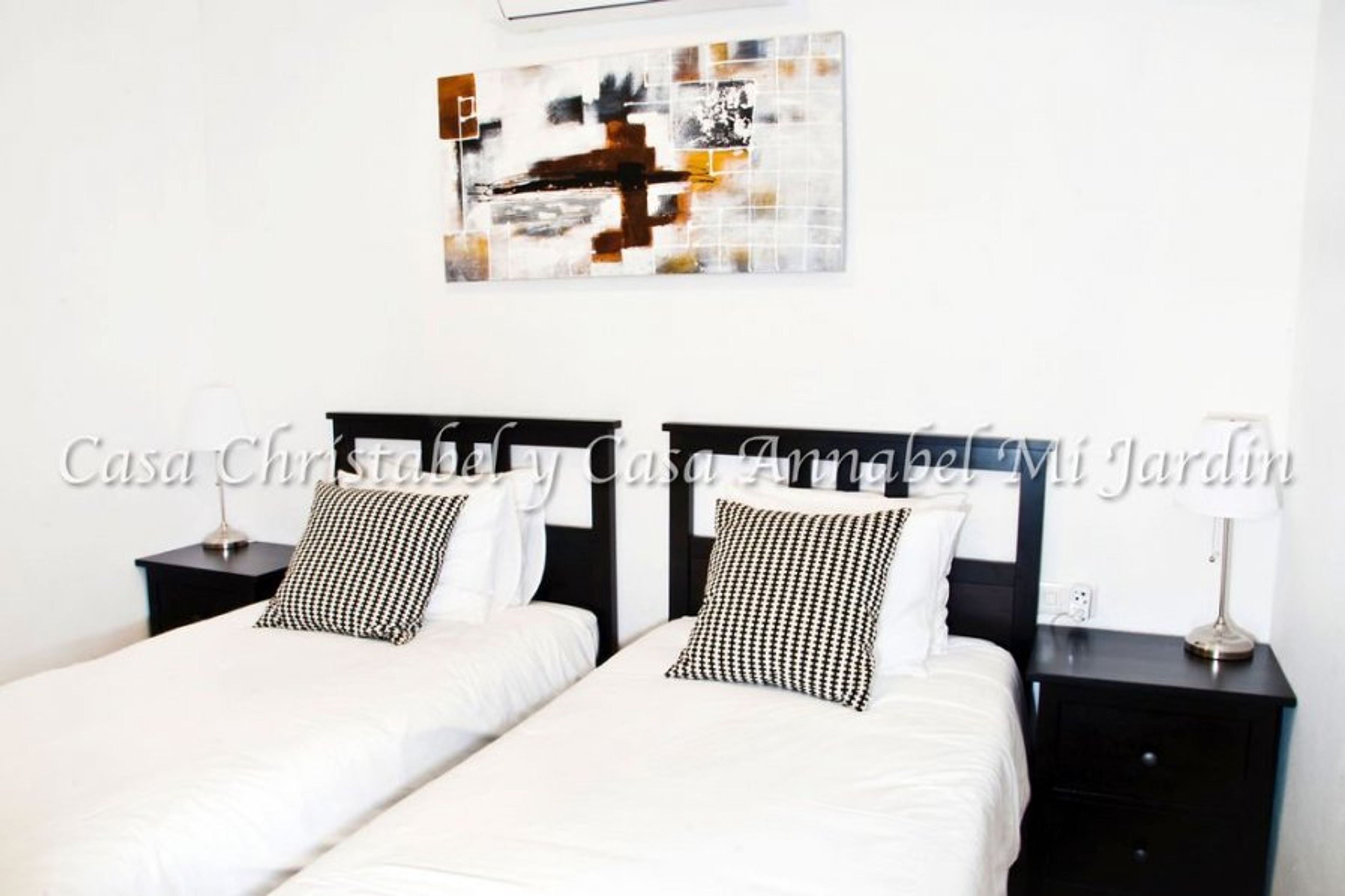 The beds made up as singles.